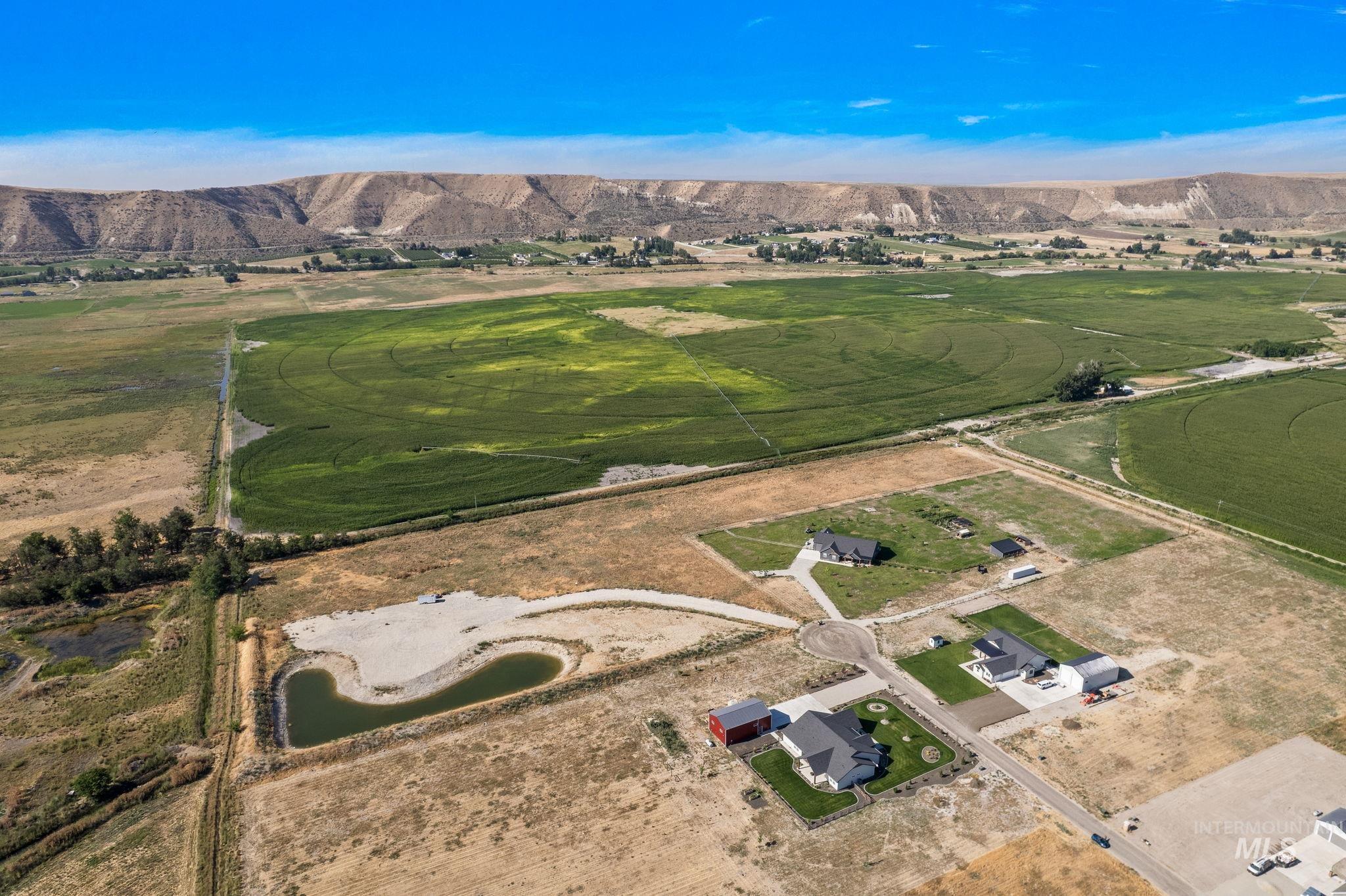 Aerial view of property's location featuring rural landscape and mountains