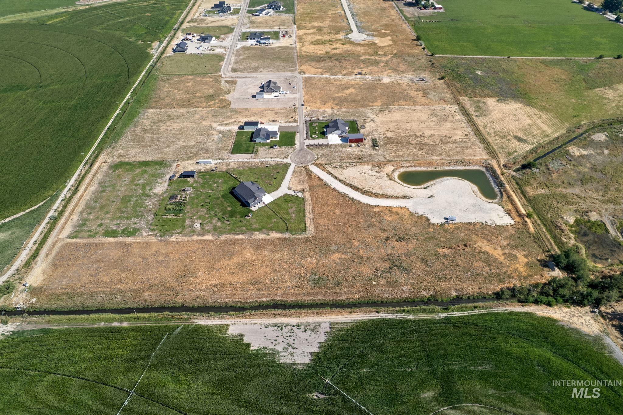 Aerial view of property and surrounding area featuring rural landscape