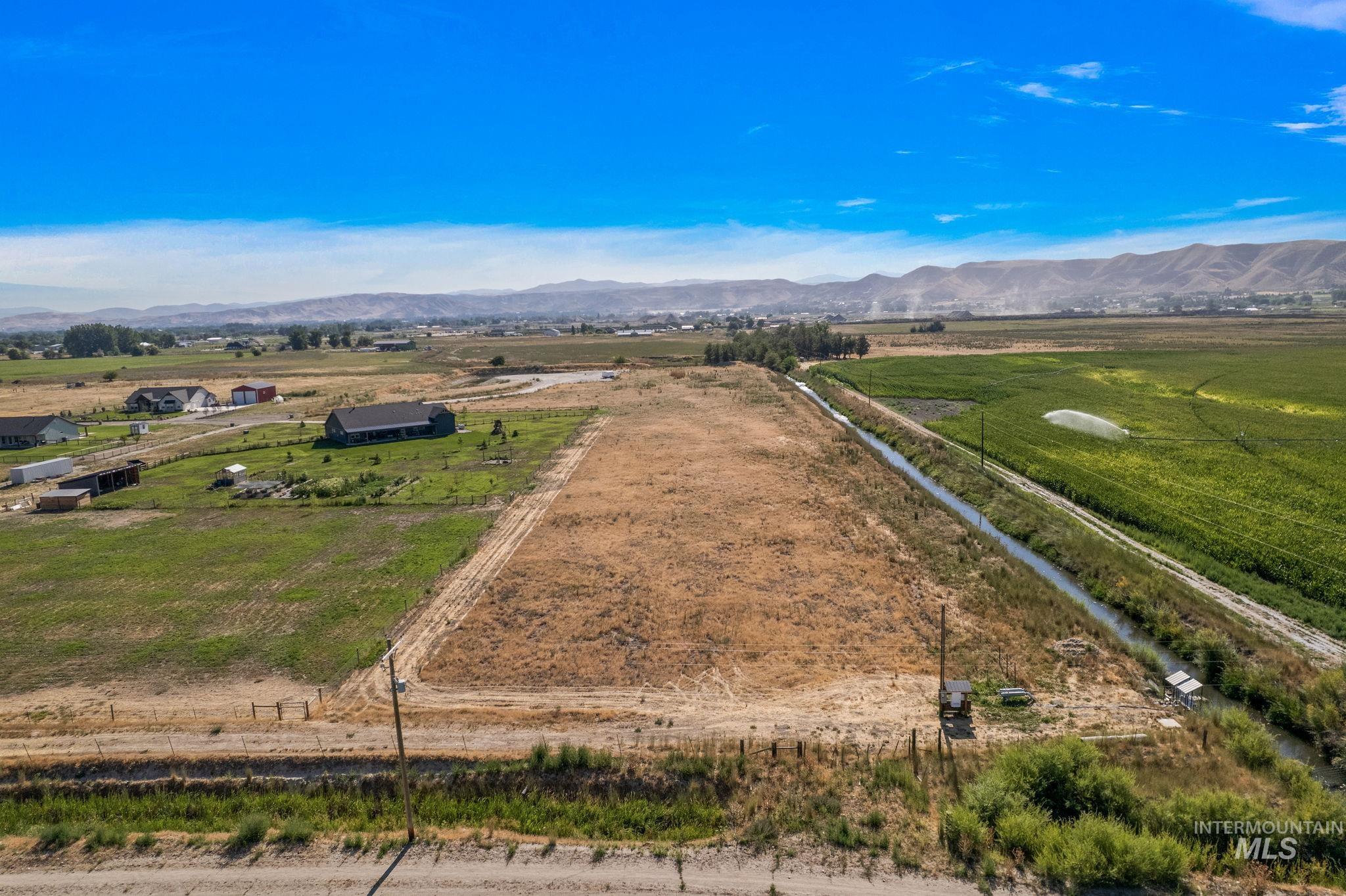 Overview of rural landscape featuring a mountain backdrop