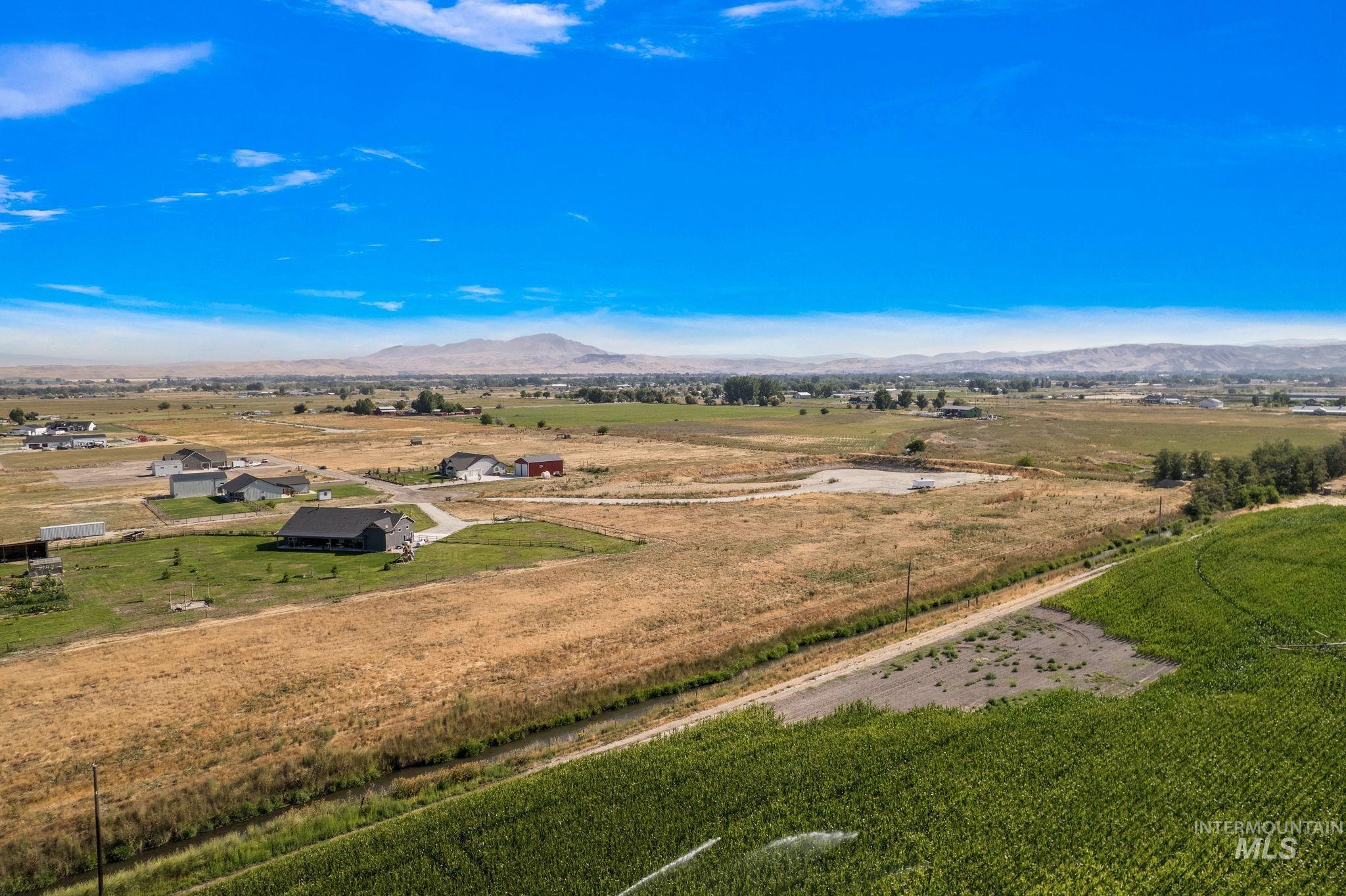 Overview of rural landscape with a mountain backdrop