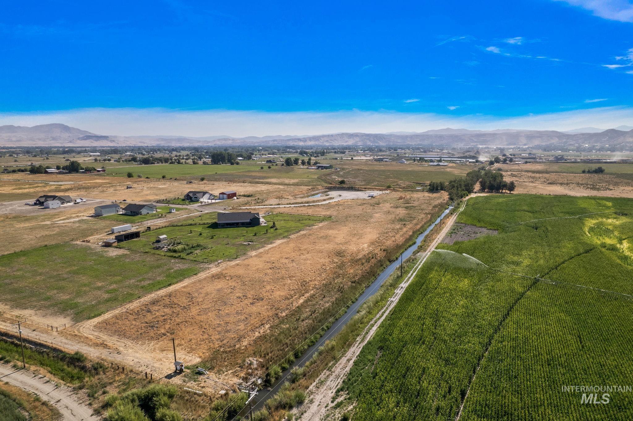 Overview of rural landscape featuring a mountain backdrop
