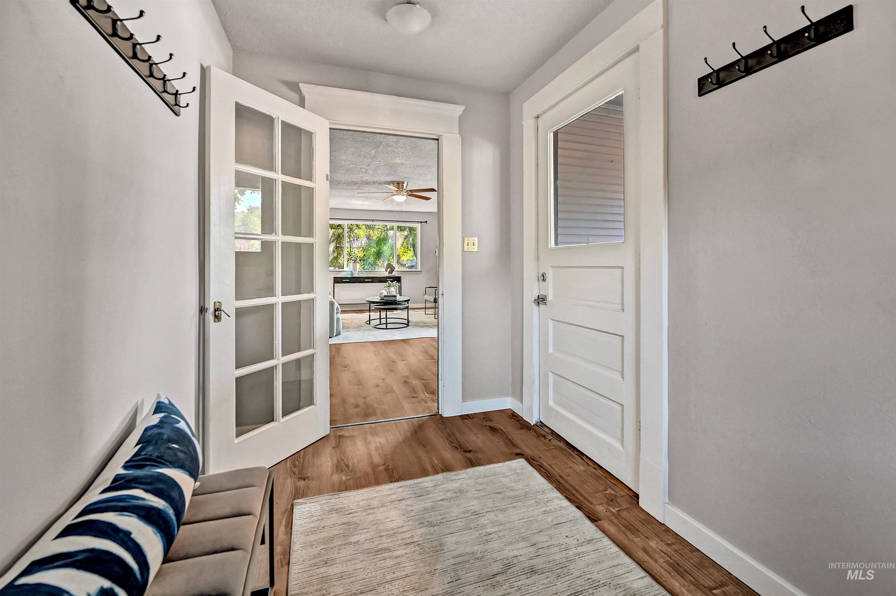 Entryway featuring wood finished floors and ceiling fan