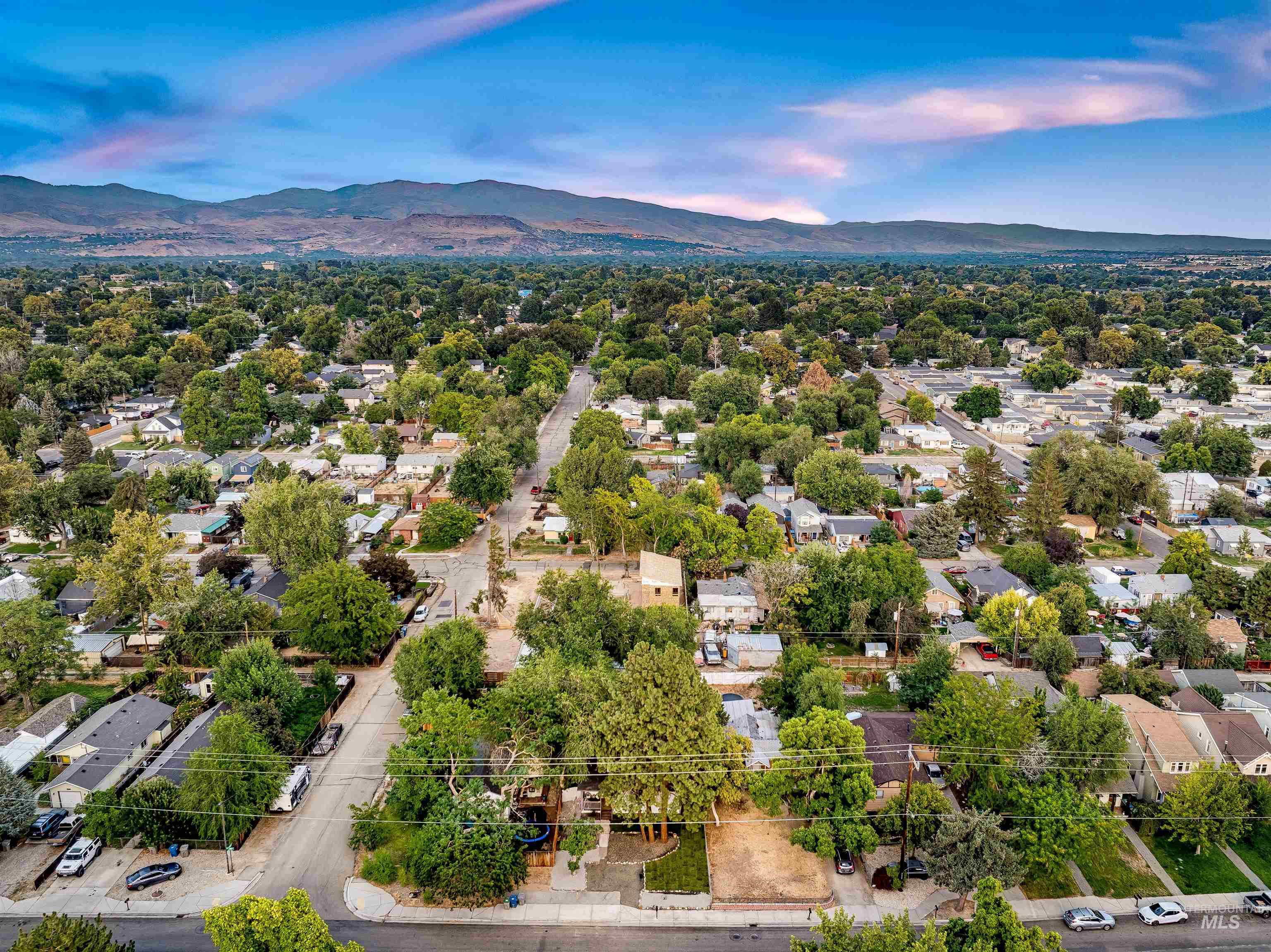 Aerial view of residential area featuring mountains