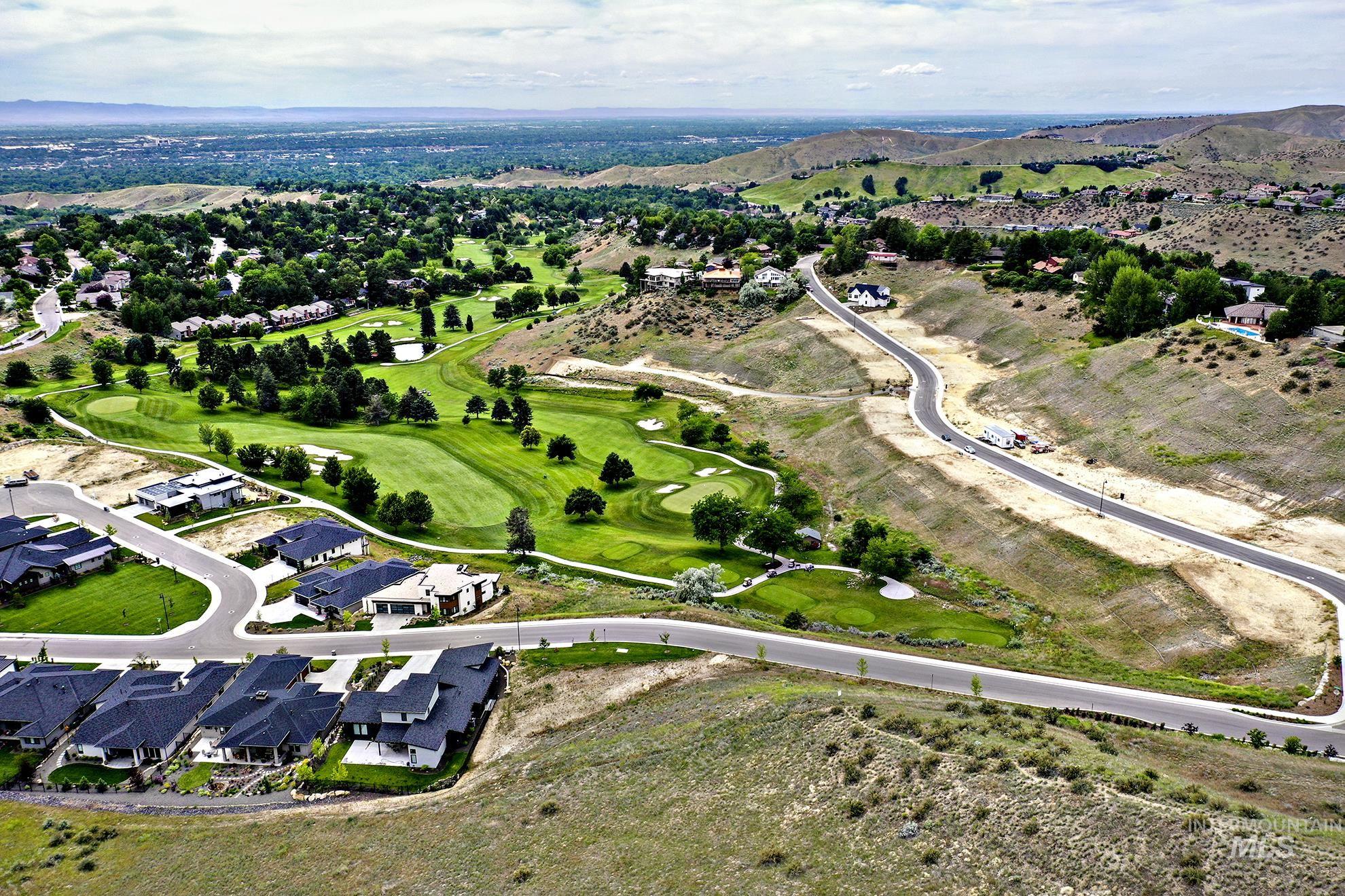 View of property location featuring nearby suburban area and a local golf course