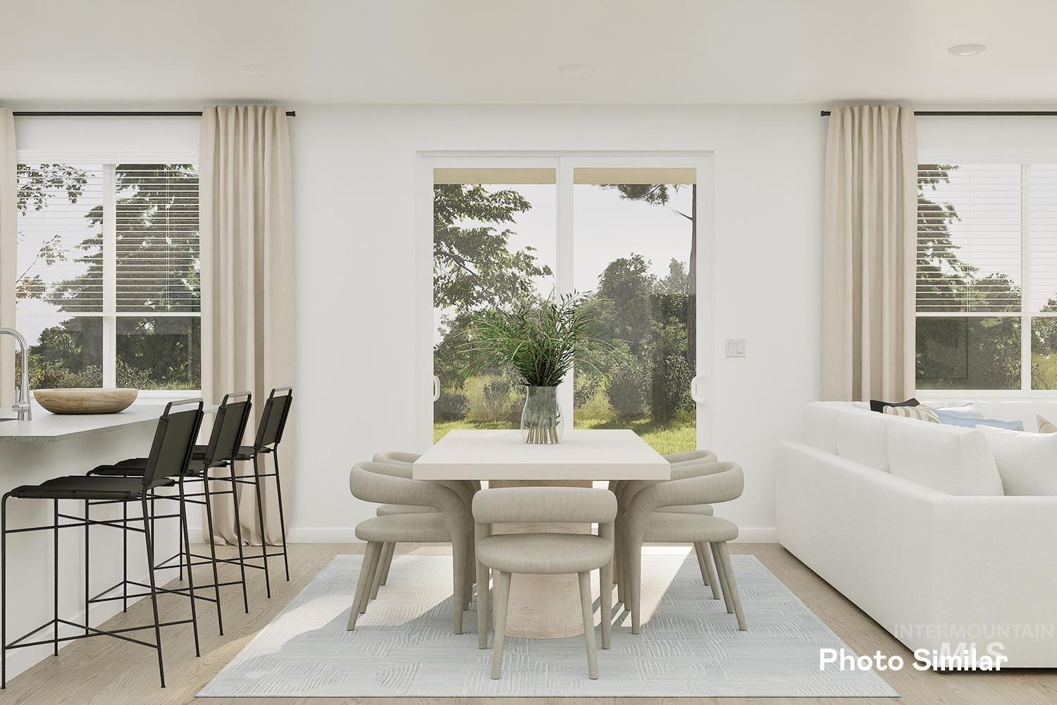 Dining space featuring plenty of natural light and light wood-type flooring