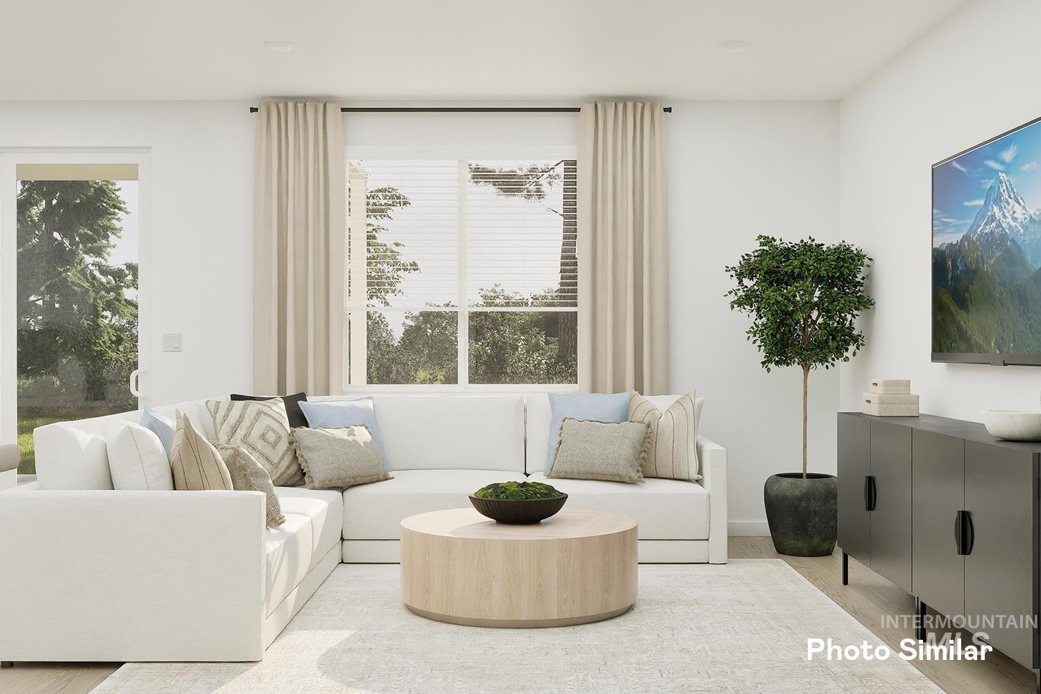 Living room with healthy amount of natural light and wood finished floors