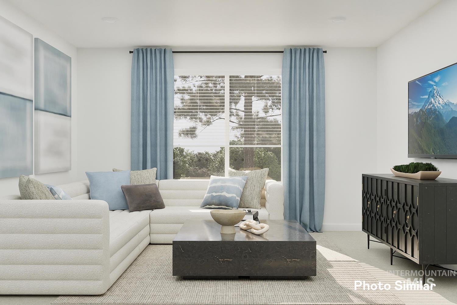 Living area featuring carpet flooring and baseboards