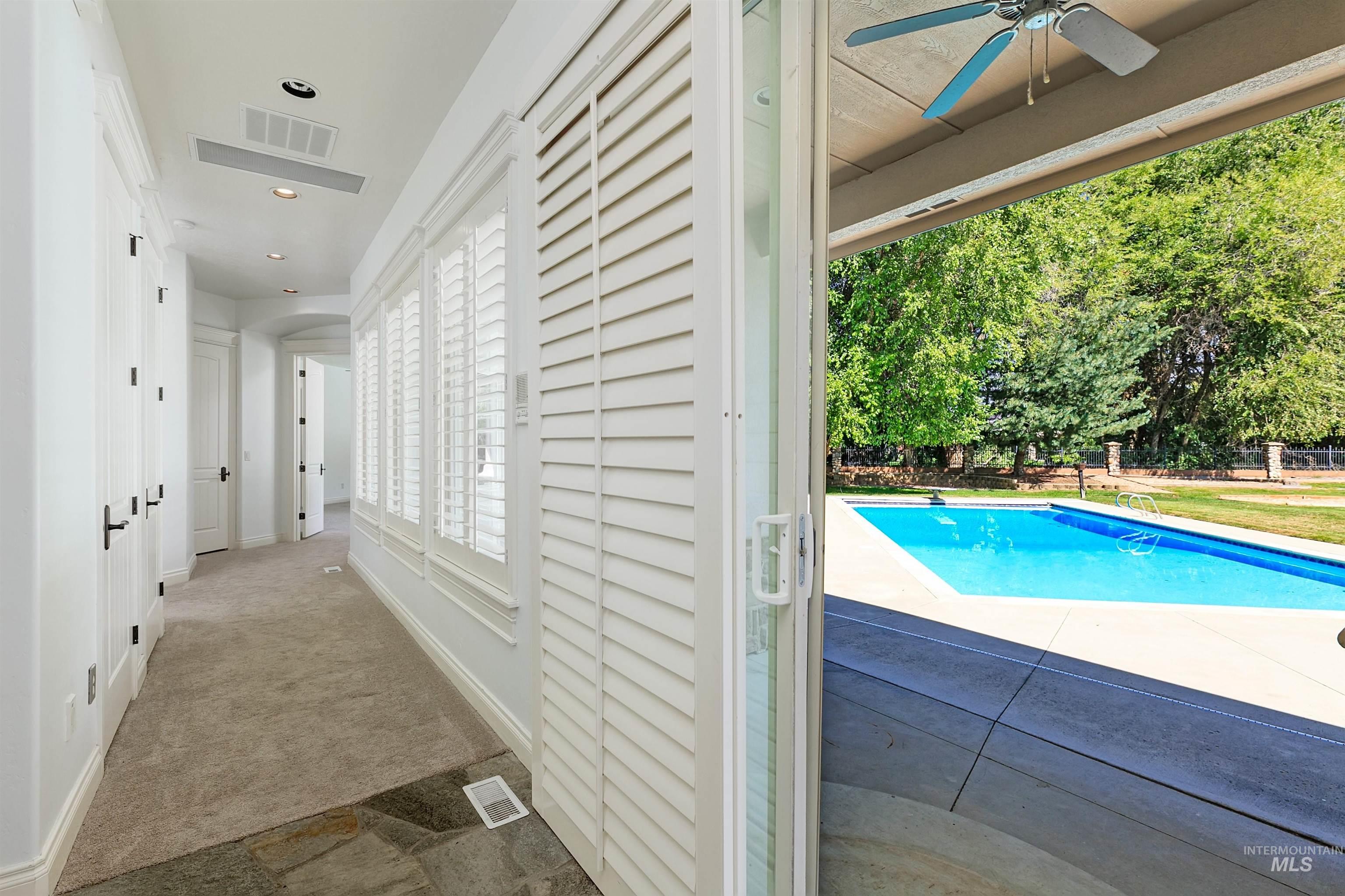 View of pool featuring a diving board