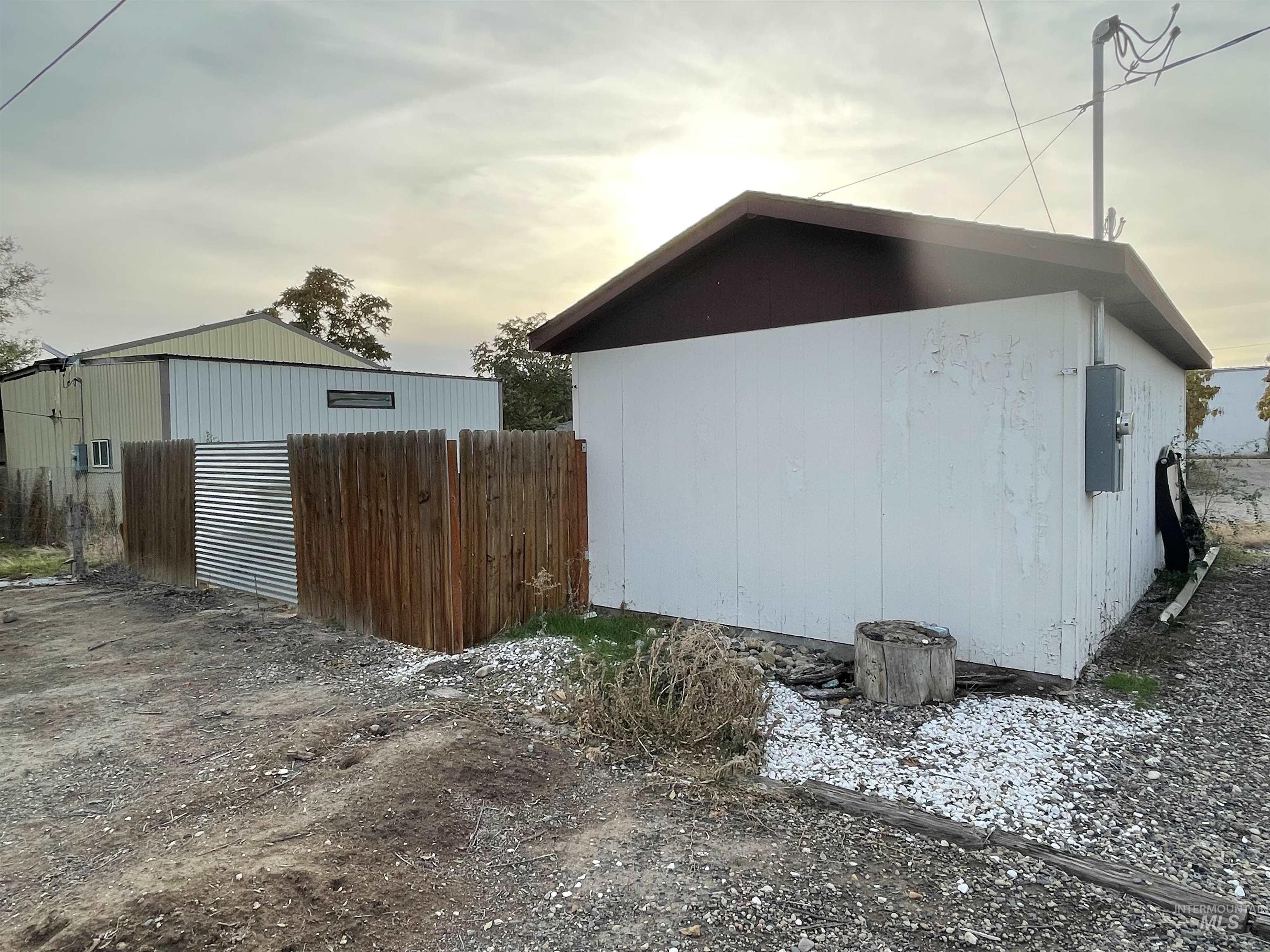 View of home's exterior featuring an outdoor structure