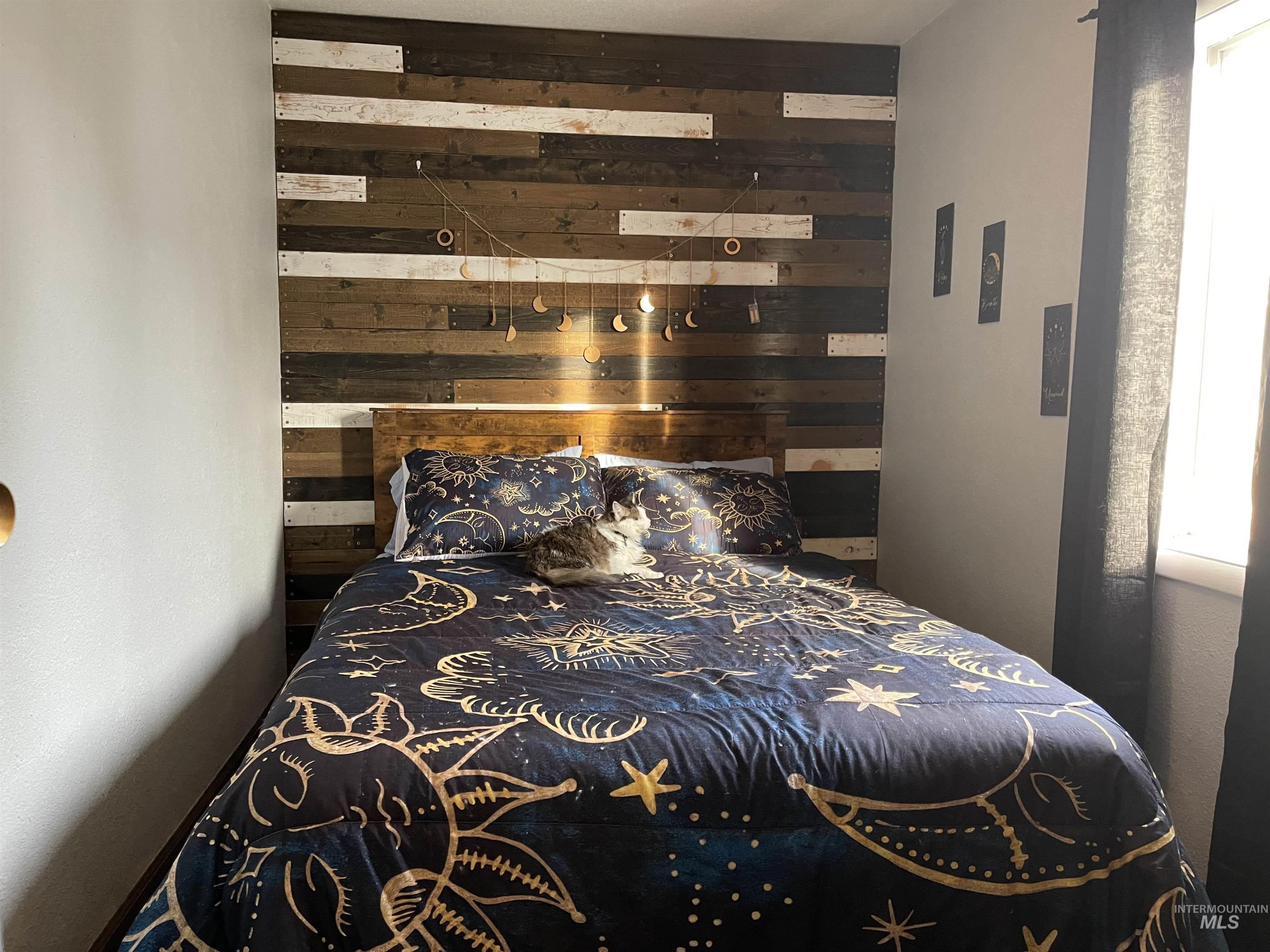 Bedroom with wooden walls