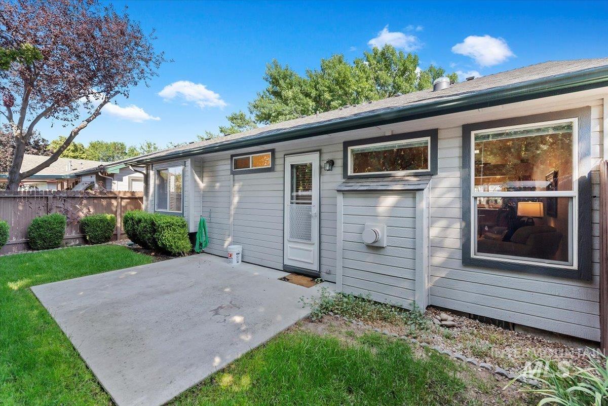 Rear view of property featuring a patio area