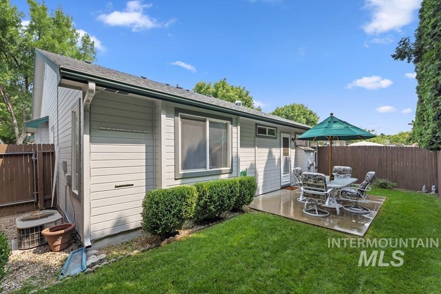 Back of property with a patio