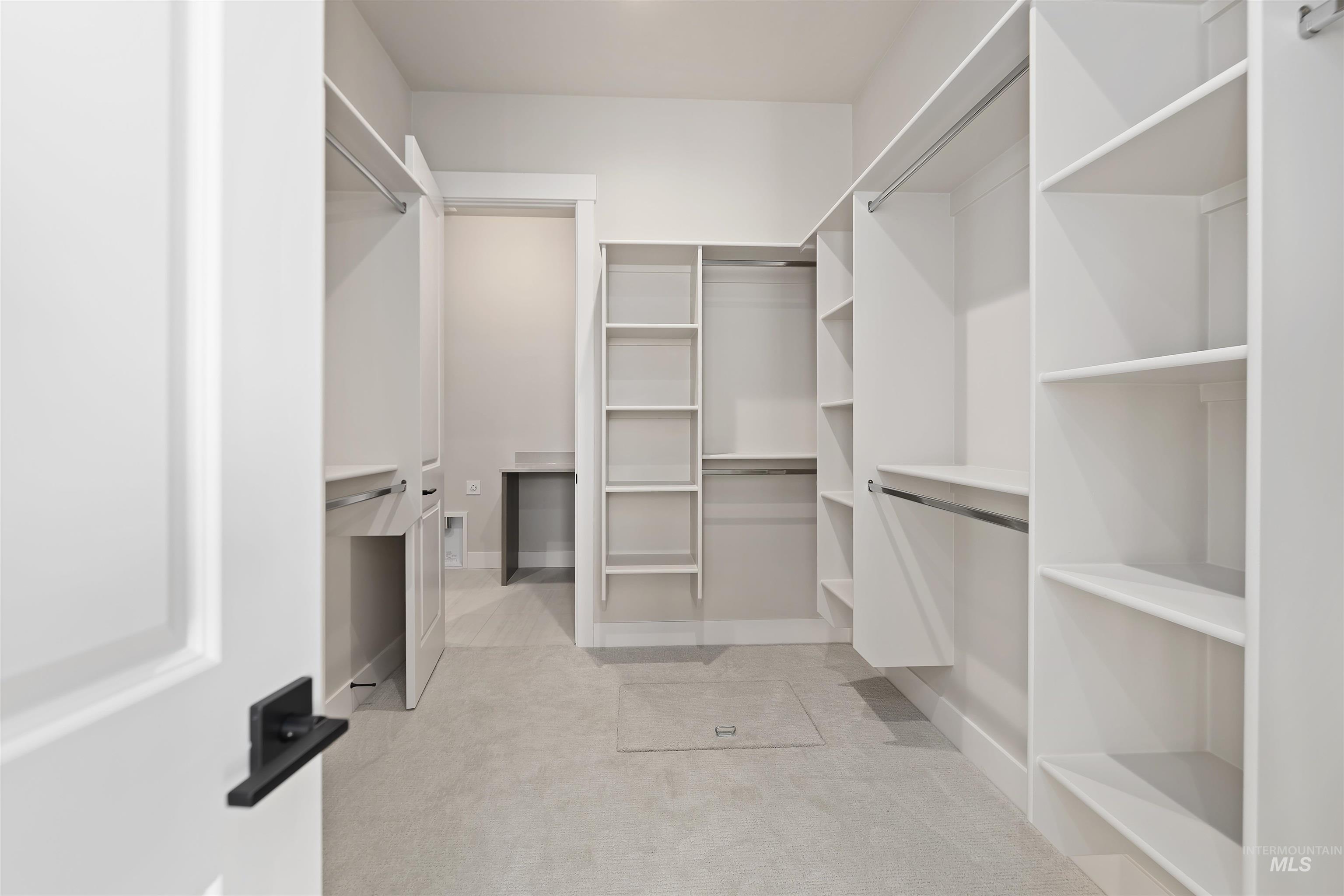 Primary bedroom walk in closet.