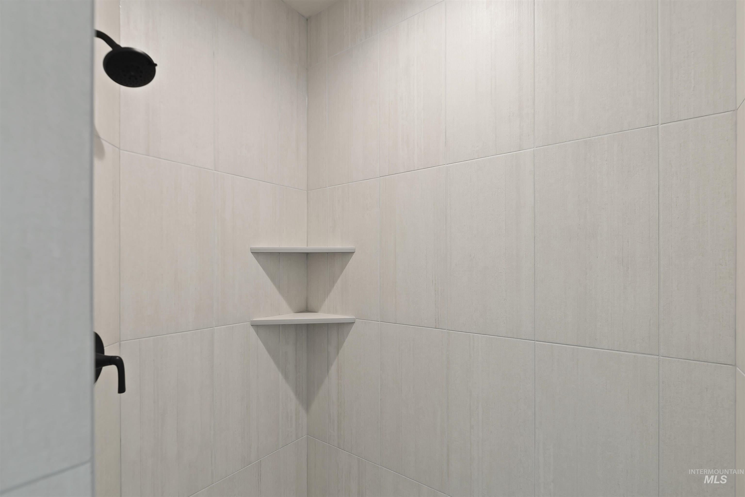 Bathroom view of a tile shower