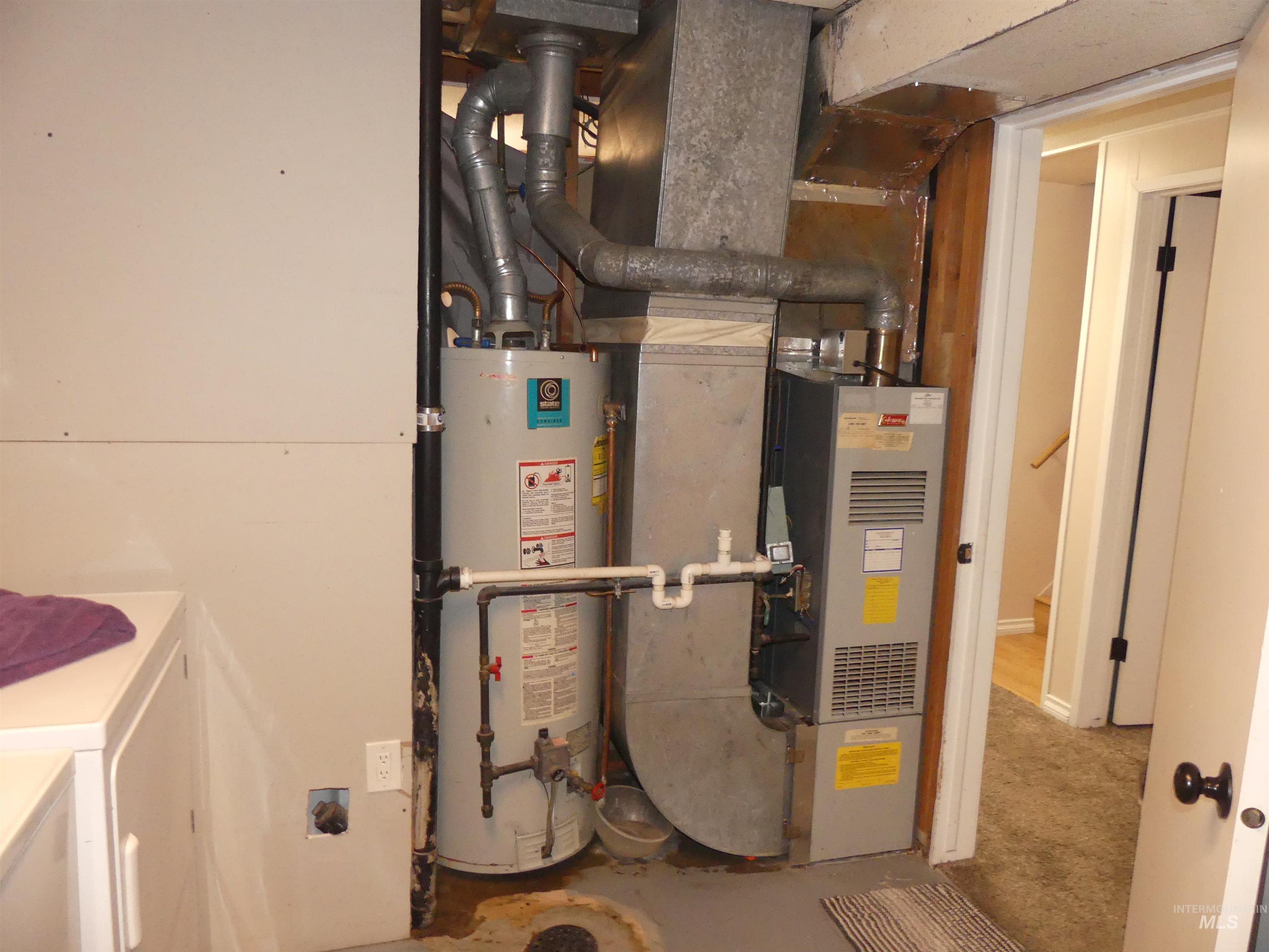 Utilities featuring gas water heater and heating unit