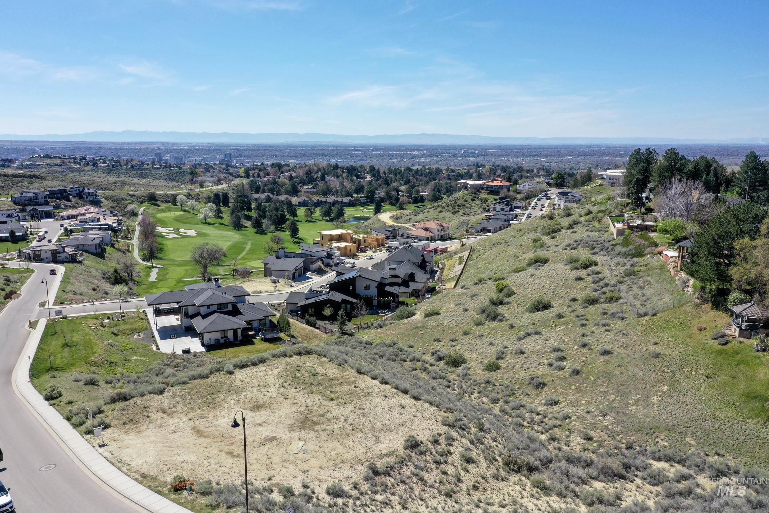 Aerial view of residential area featuring a local golf course