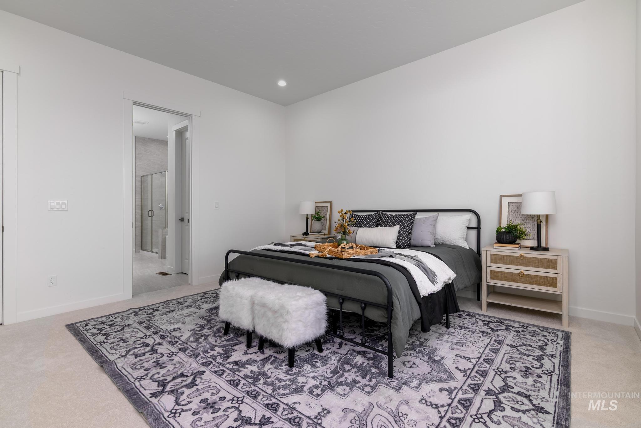 Bedroom with light carpet and recessed lighting