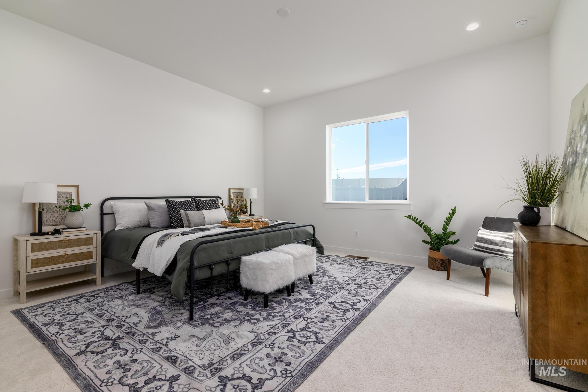 Bedroom featuring light colored carpet and recessed lighting