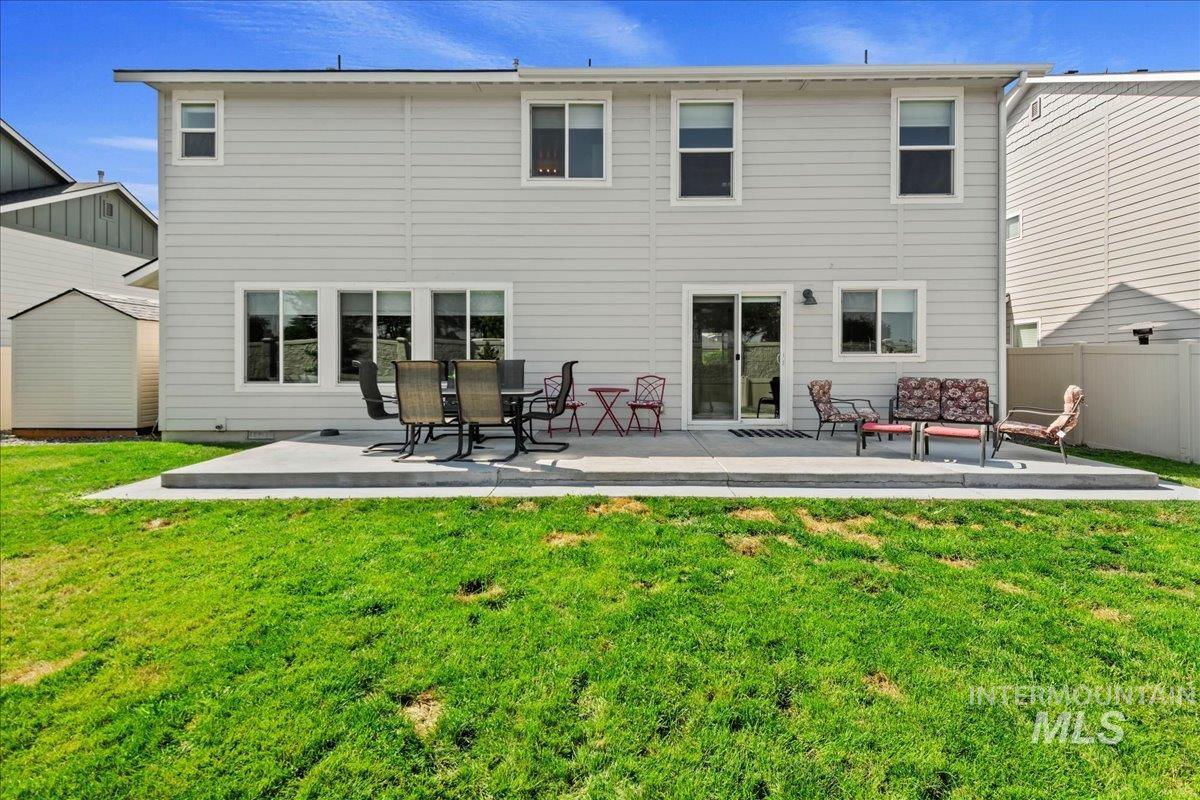 Back of house featuring a patio area and outdoor lounge area