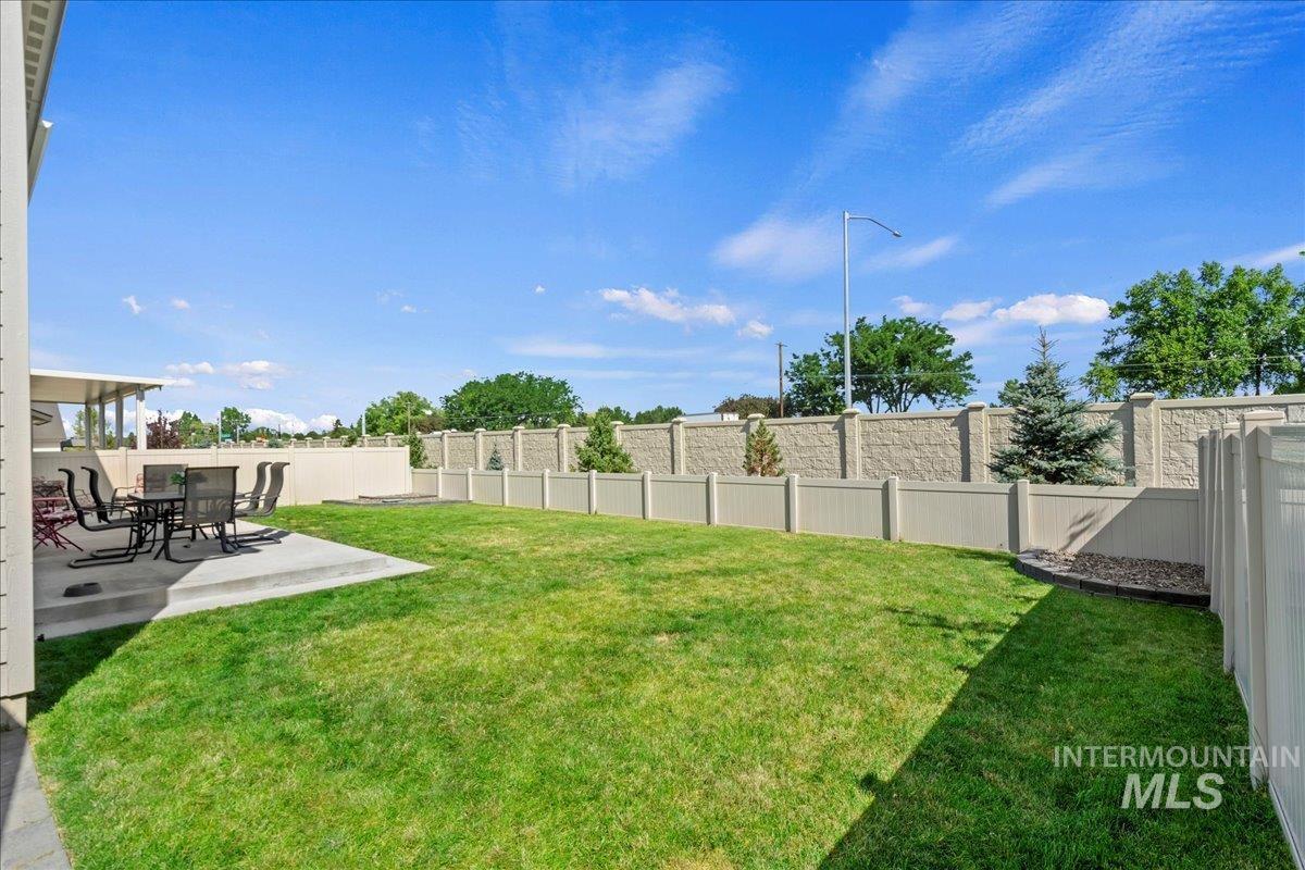 Fenced backyard featuring a patio area