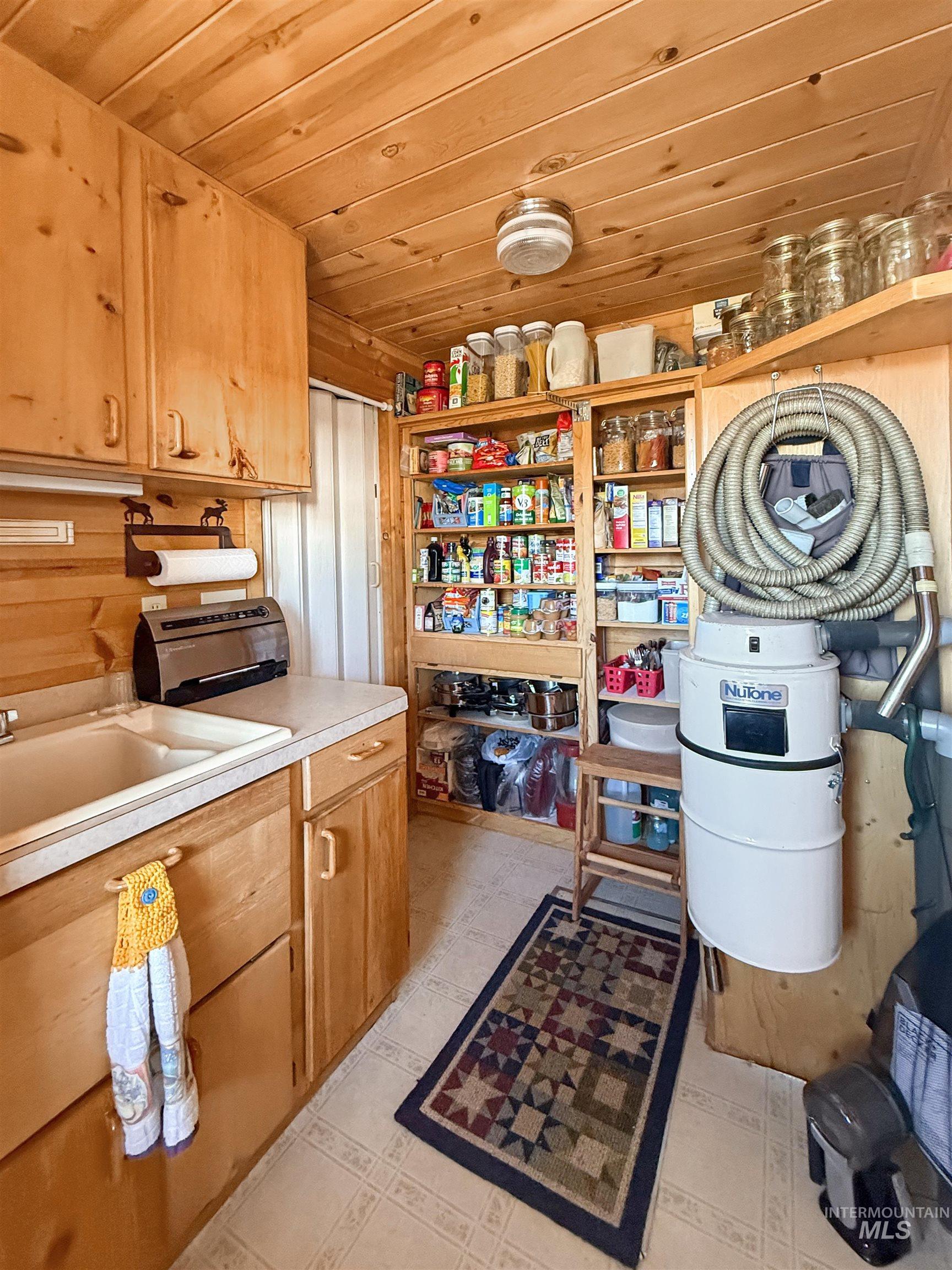 Storage room featuring a sink