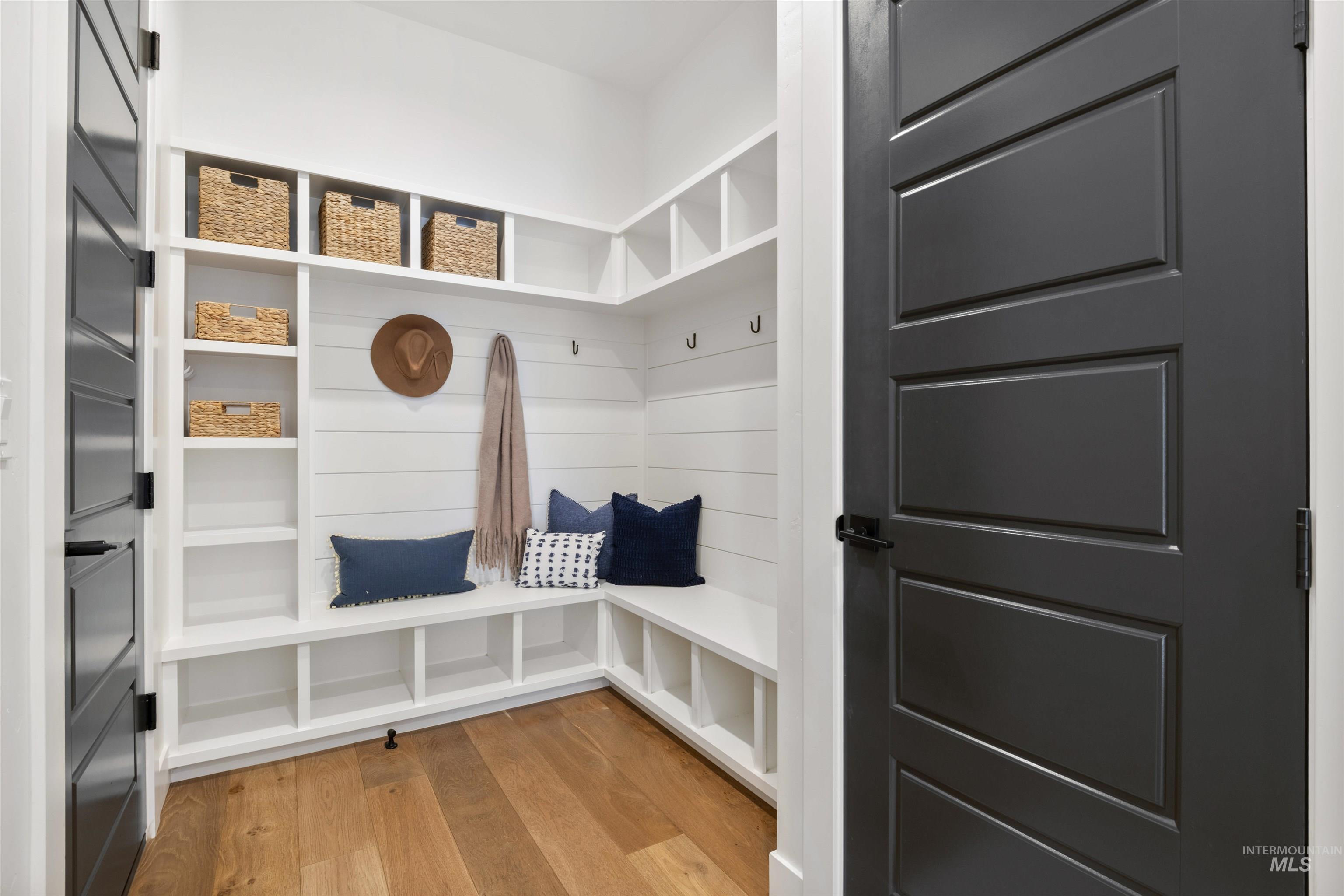 Mudroom with light wood-style flooring