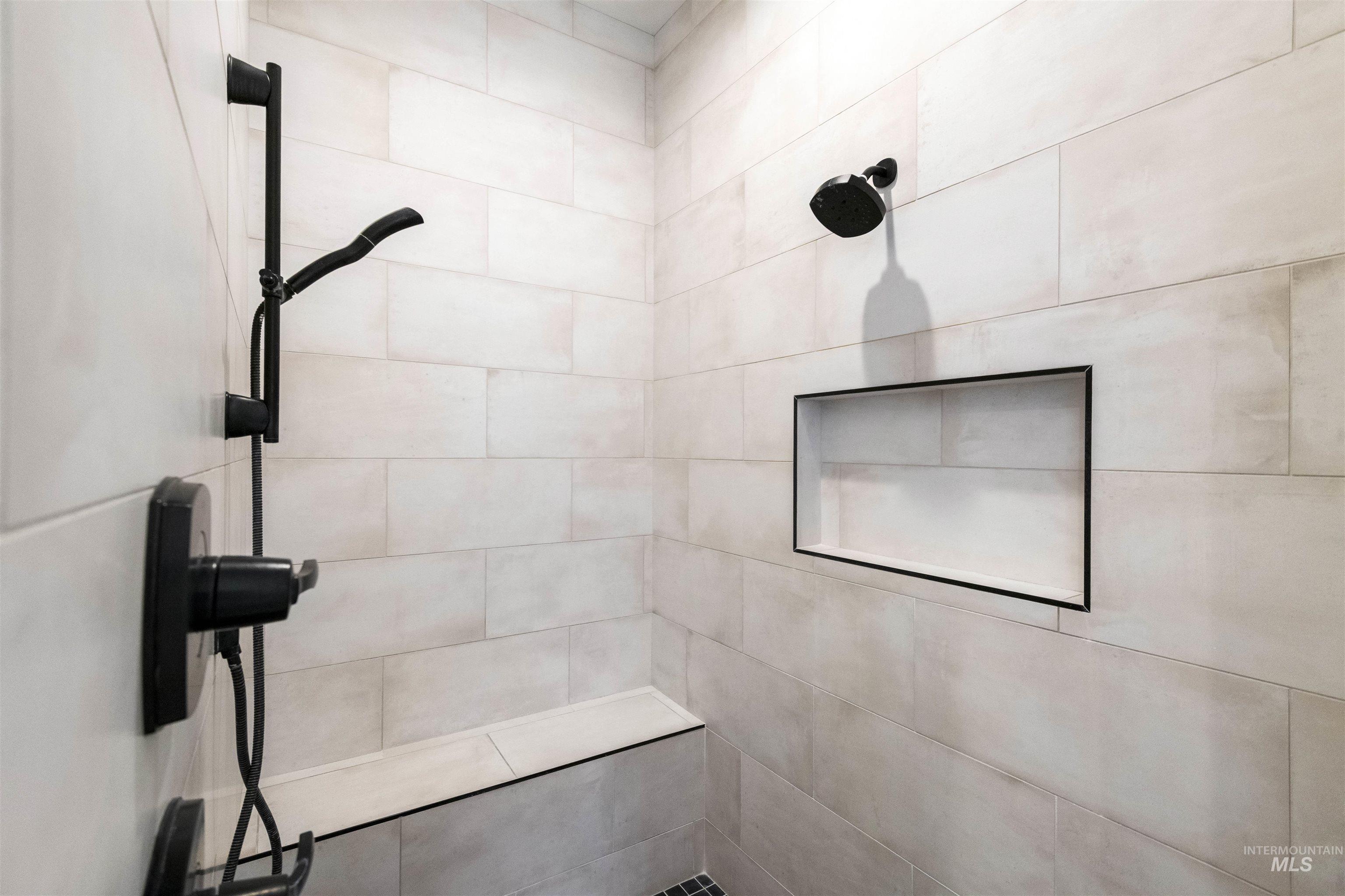 Bathroom featuring a tile shower