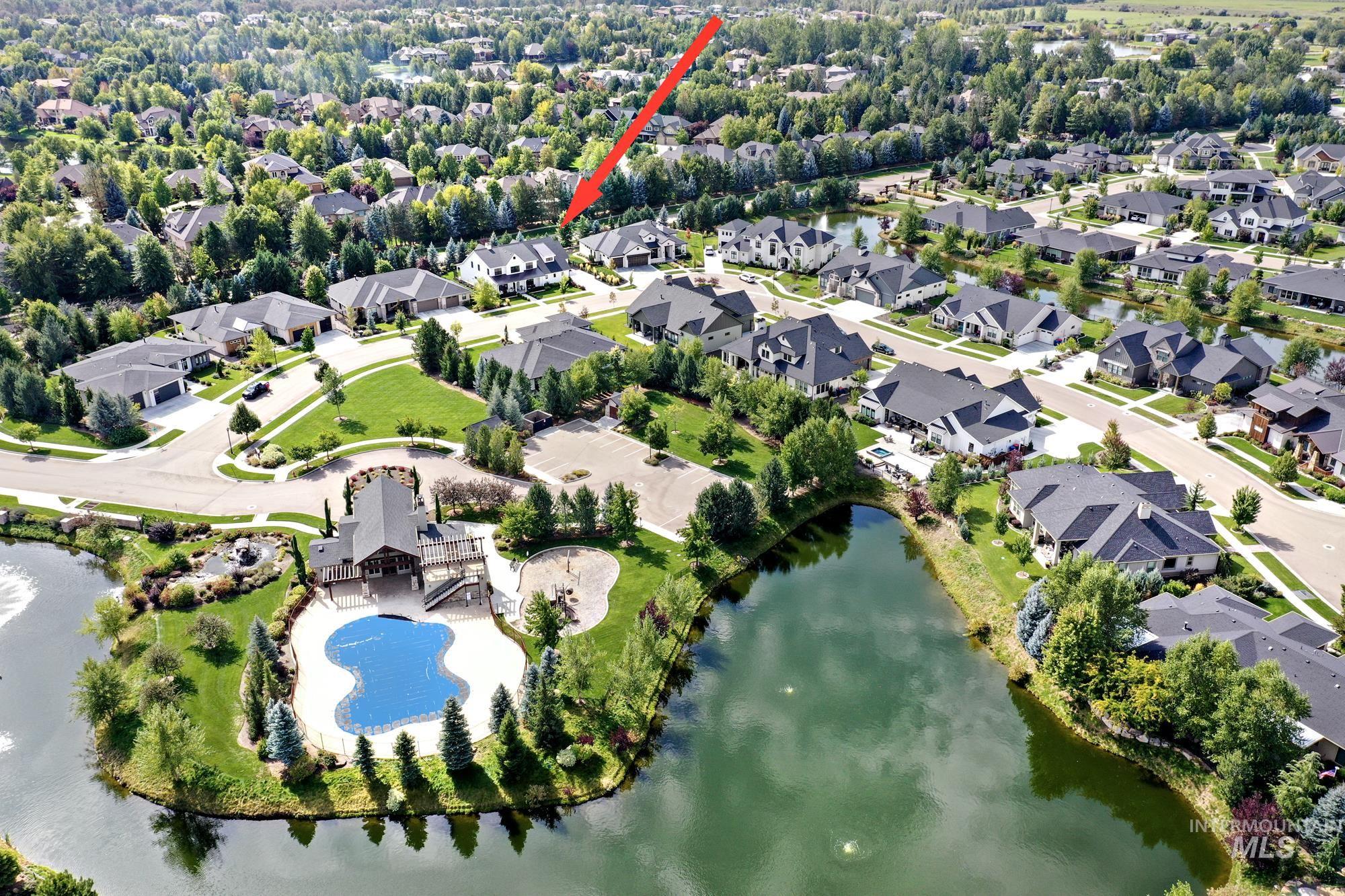 View of property location featuring a large body of water and nearby suburban area