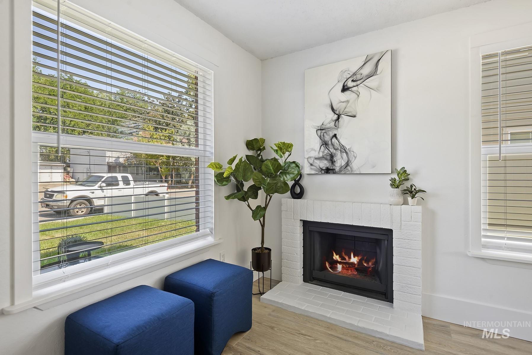 Sitting room featuring wood finished floors and a fireplace