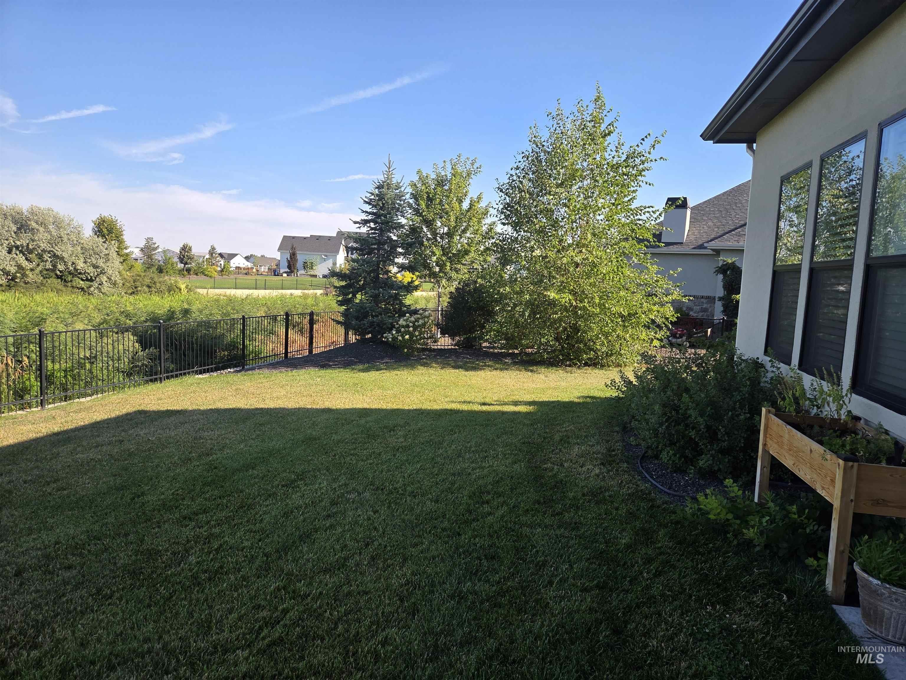 View of fenced backyard