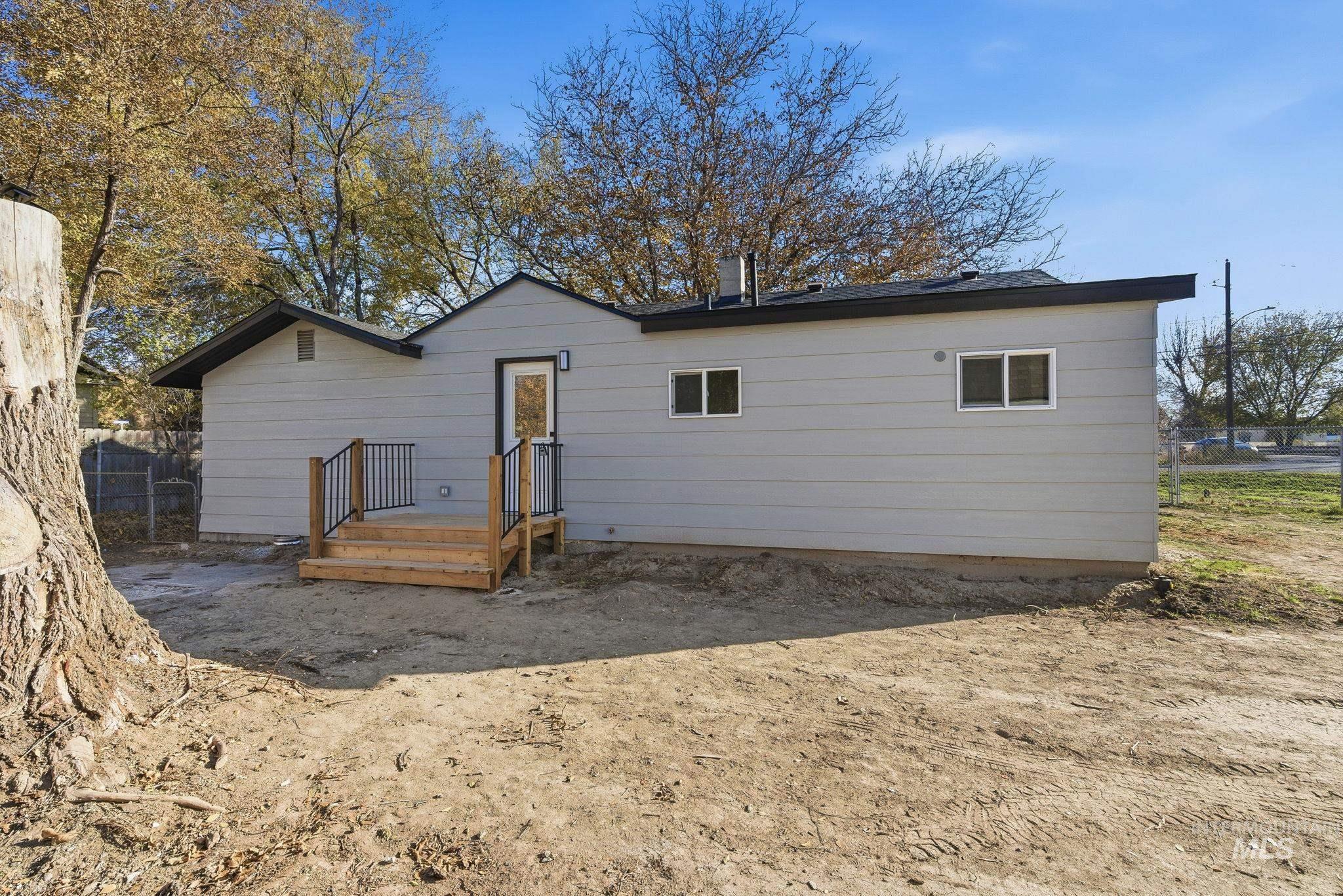 Back of property with a deck