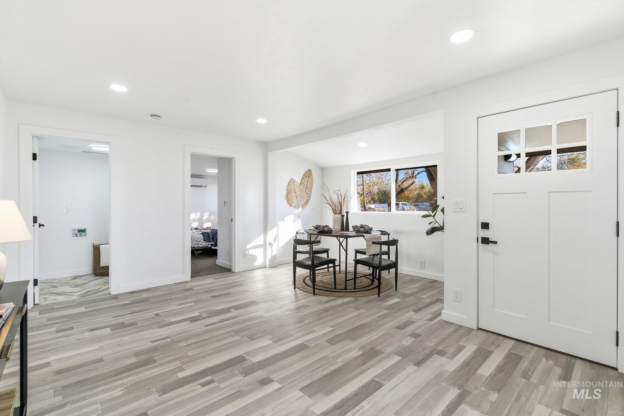 Entryway with recessed lighting and light wood-type flooring