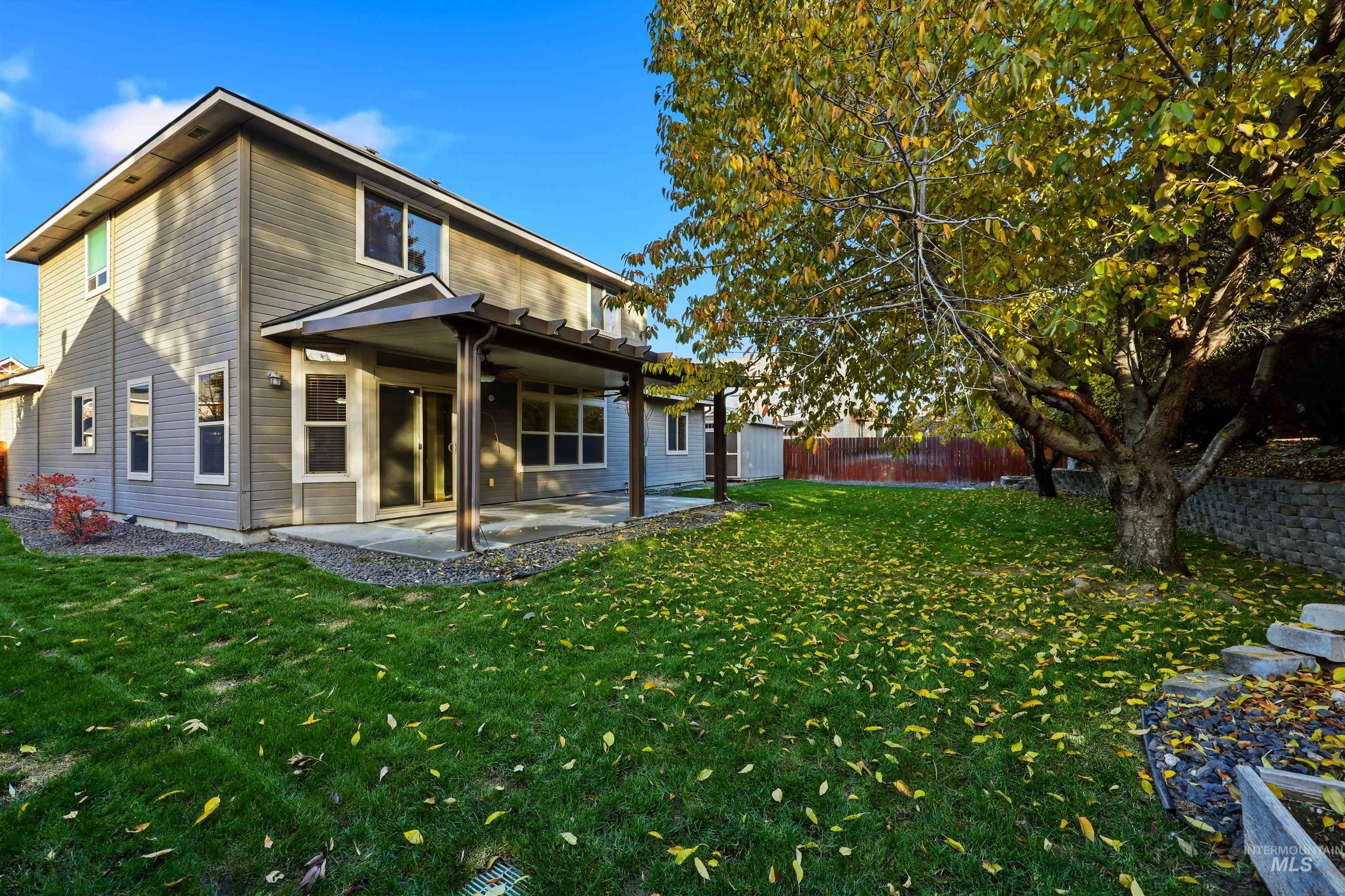 Rear view of property featuring a patio area and a fenced backyard