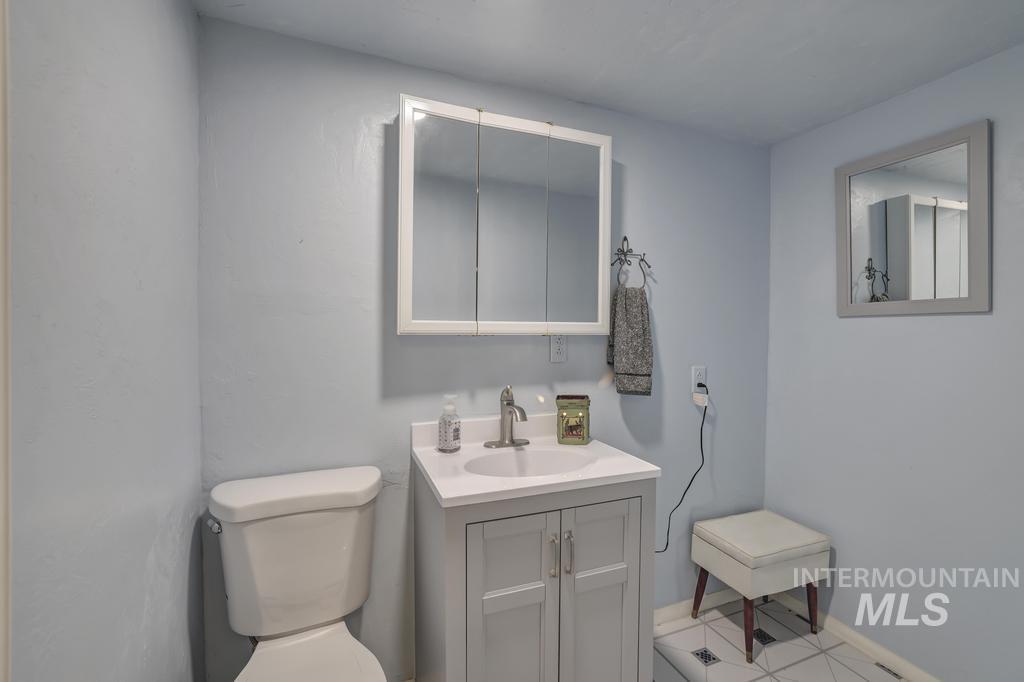 Bathroom featuring toilet and vanity