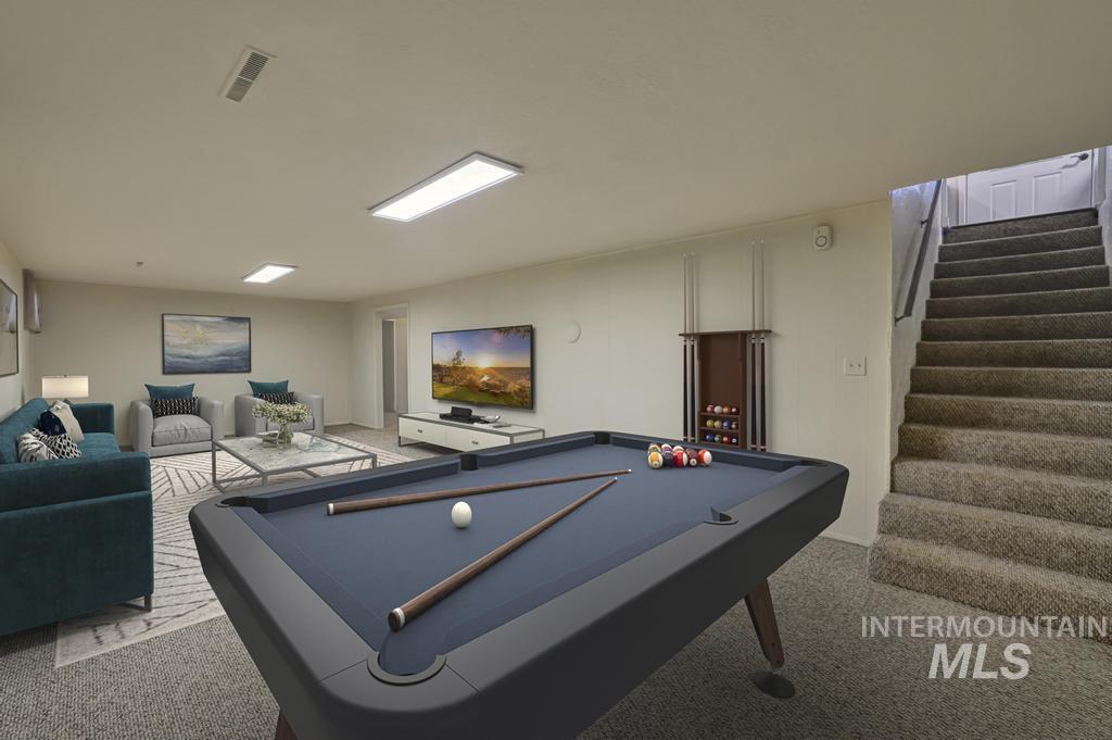 Game room with pool table and light colored carpet