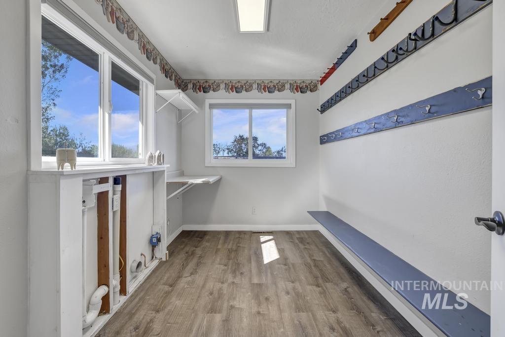 Walk in closet featuring wood finished floors