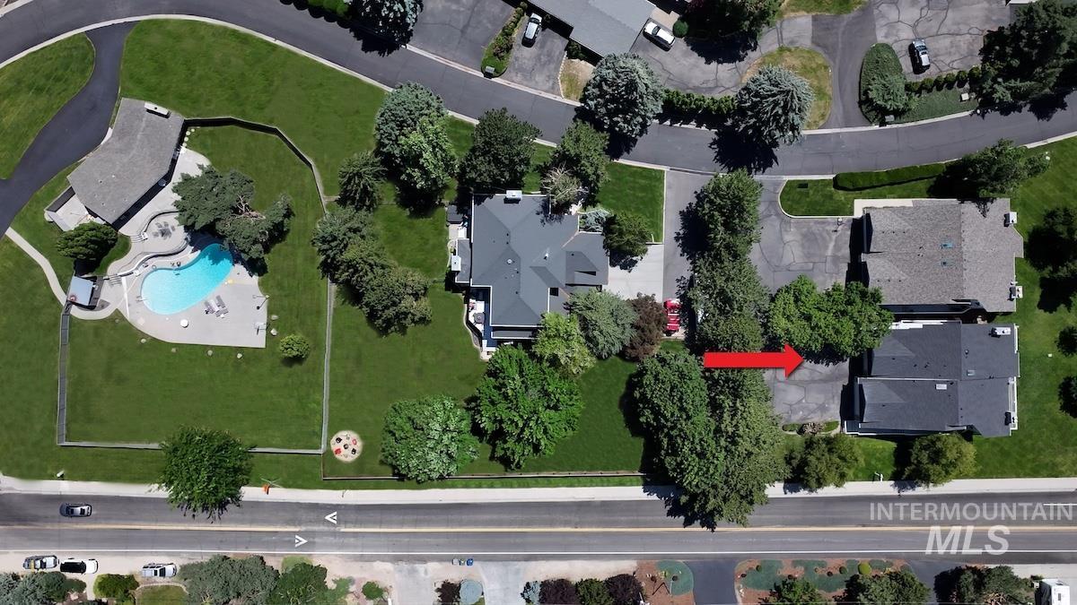 Aerial view of property's location with a pool