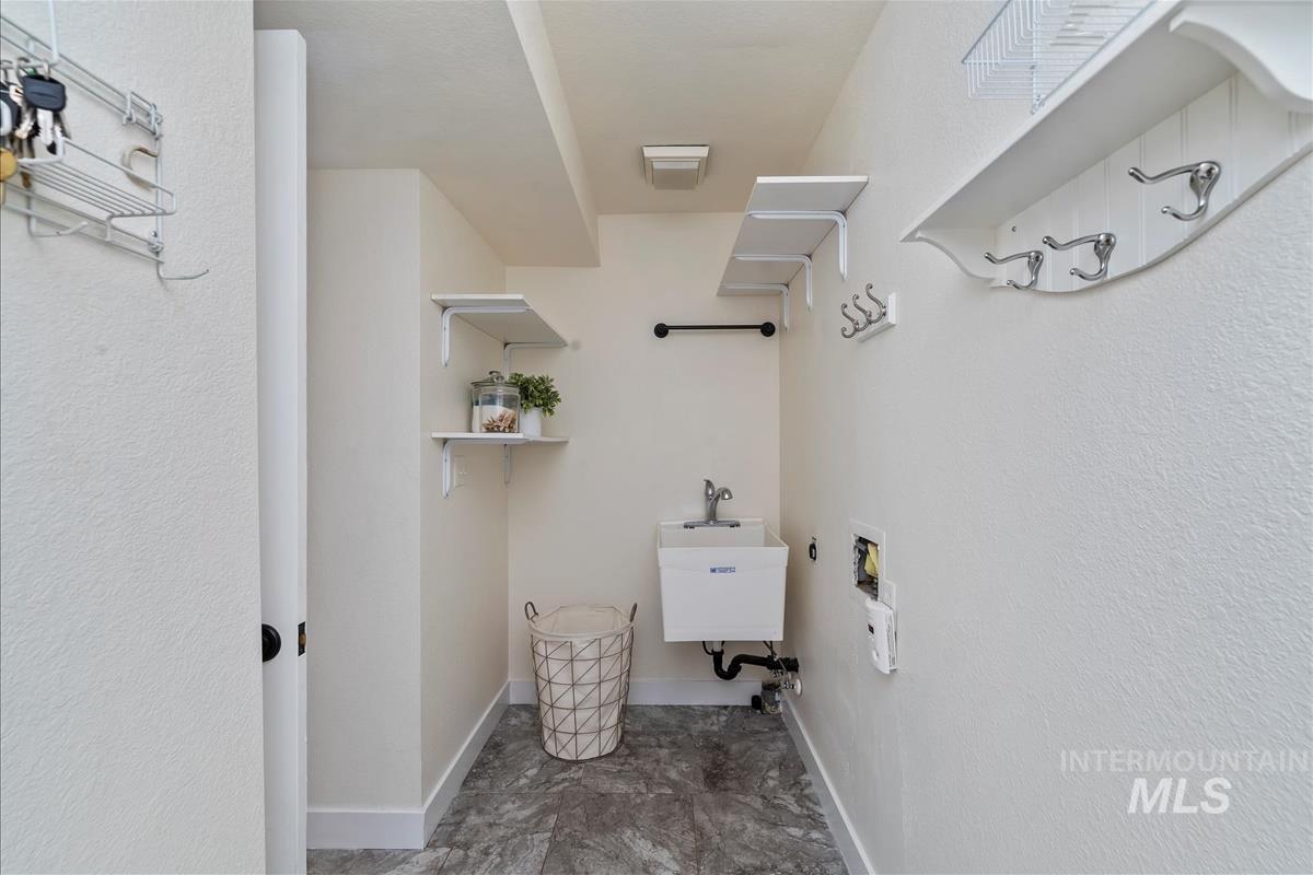 Main level laundry/mudroom with utility sink