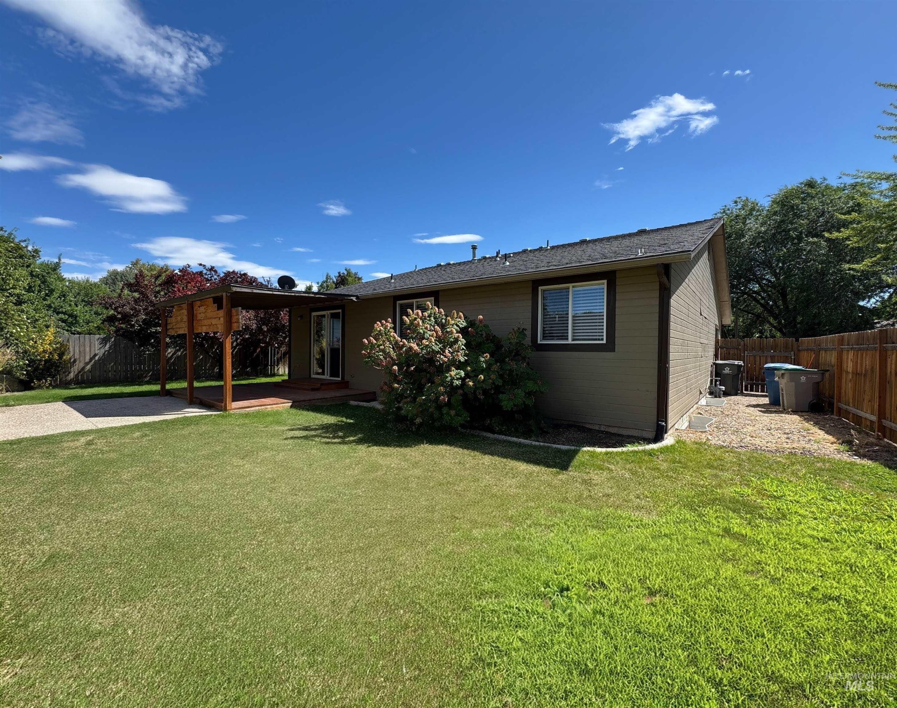 Back of house featuring a patio area and a fenced backyard
