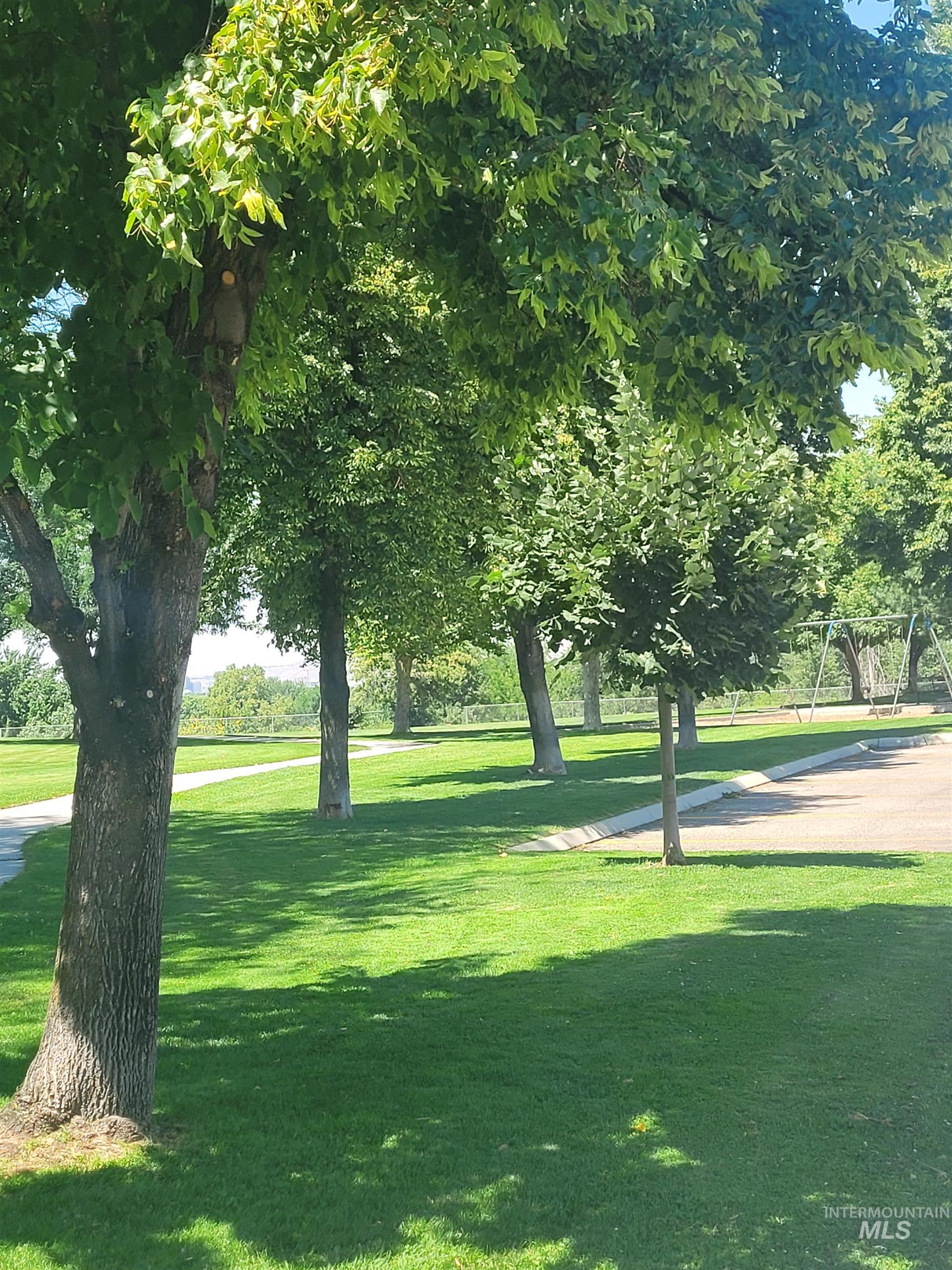 View of property's community featuring a lawn
