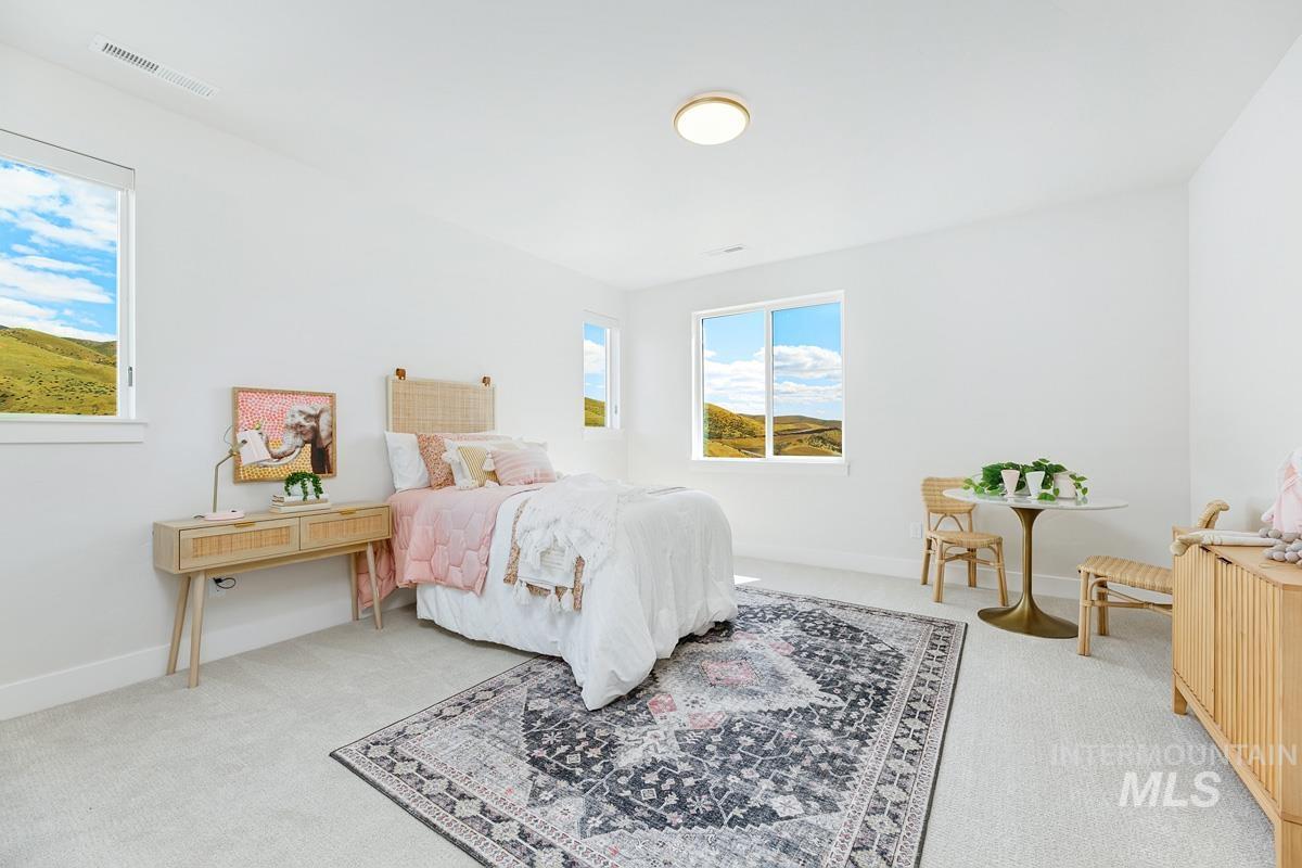 Bedroom with light carpet