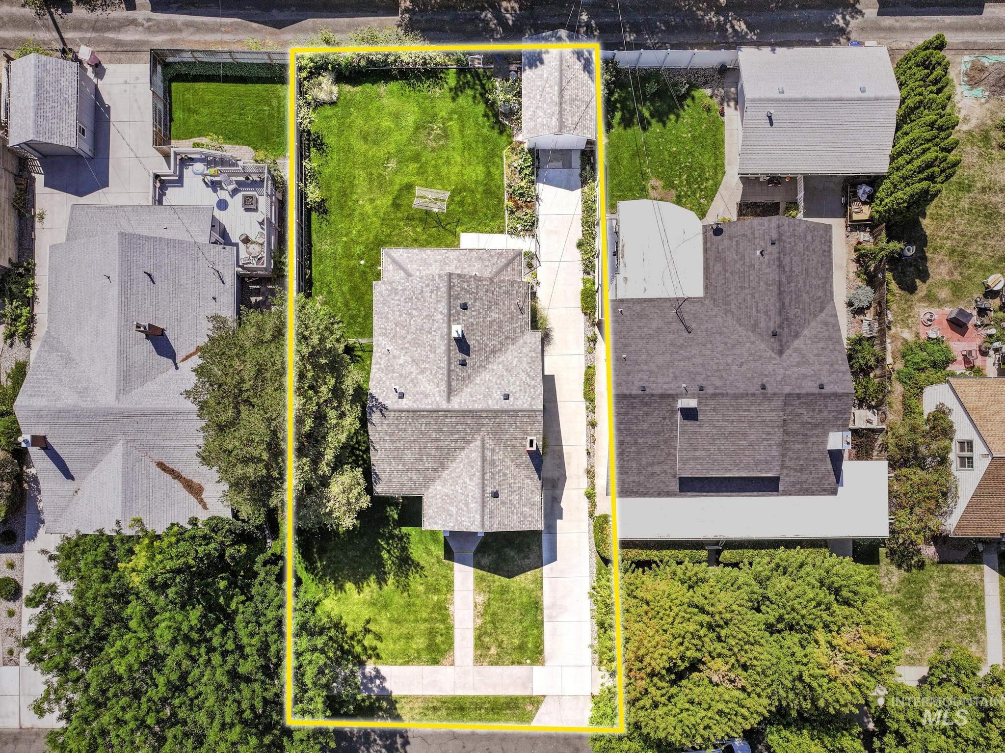 Aerial view of residential area with property parcel outlined