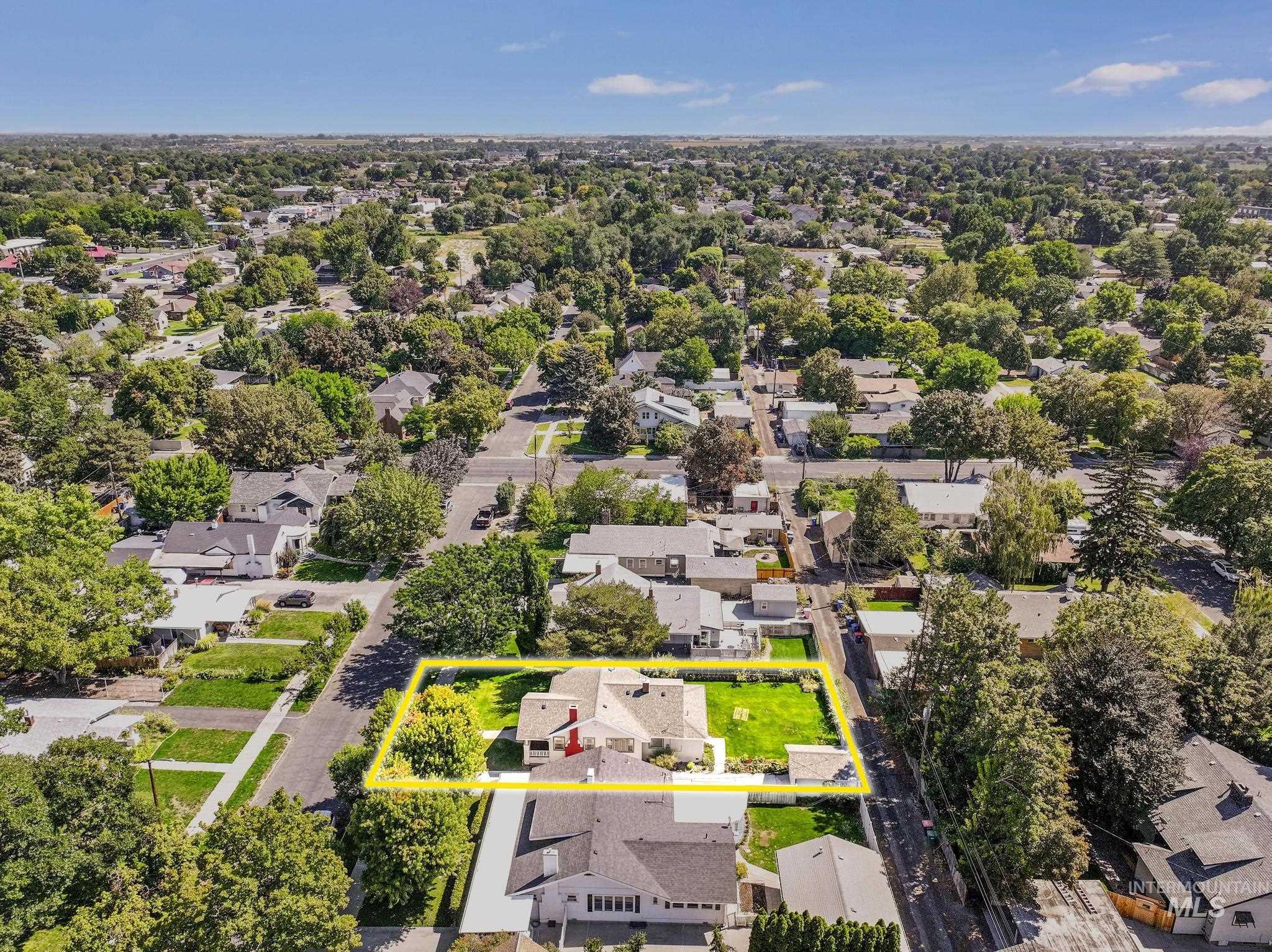 Aerial perspective of suburban area featuring property parcel outlined