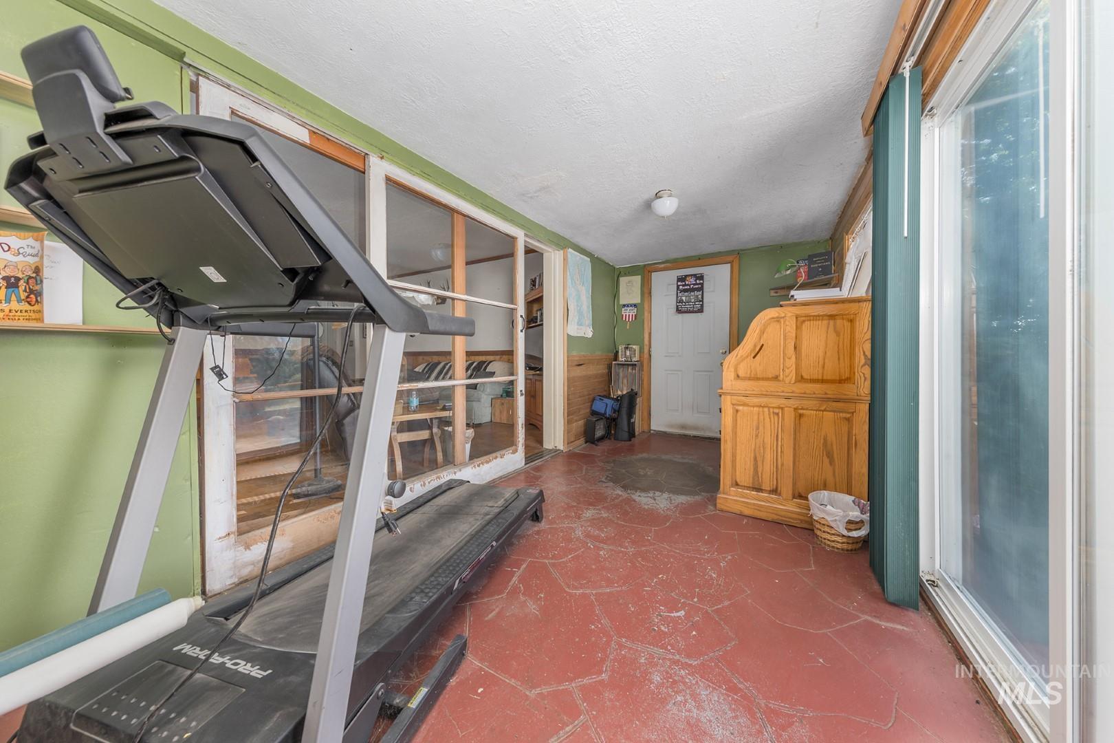 Workout area with a textured ceiling