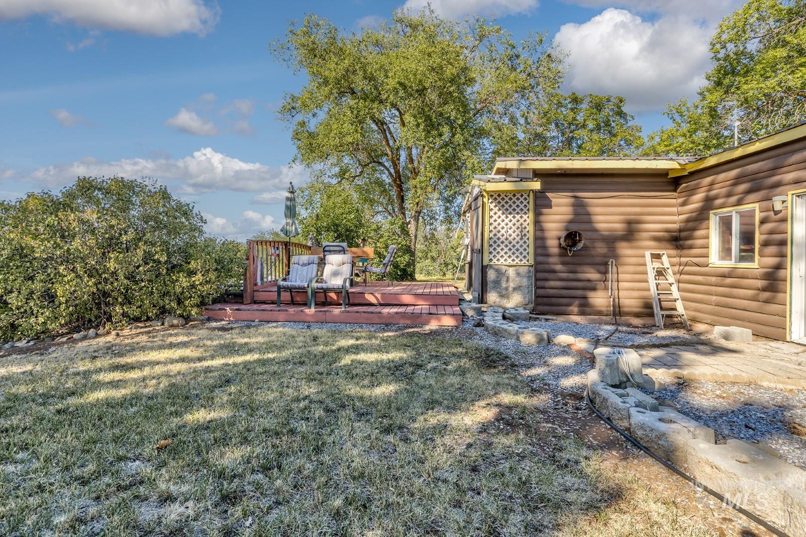 View of green lawn with a deck