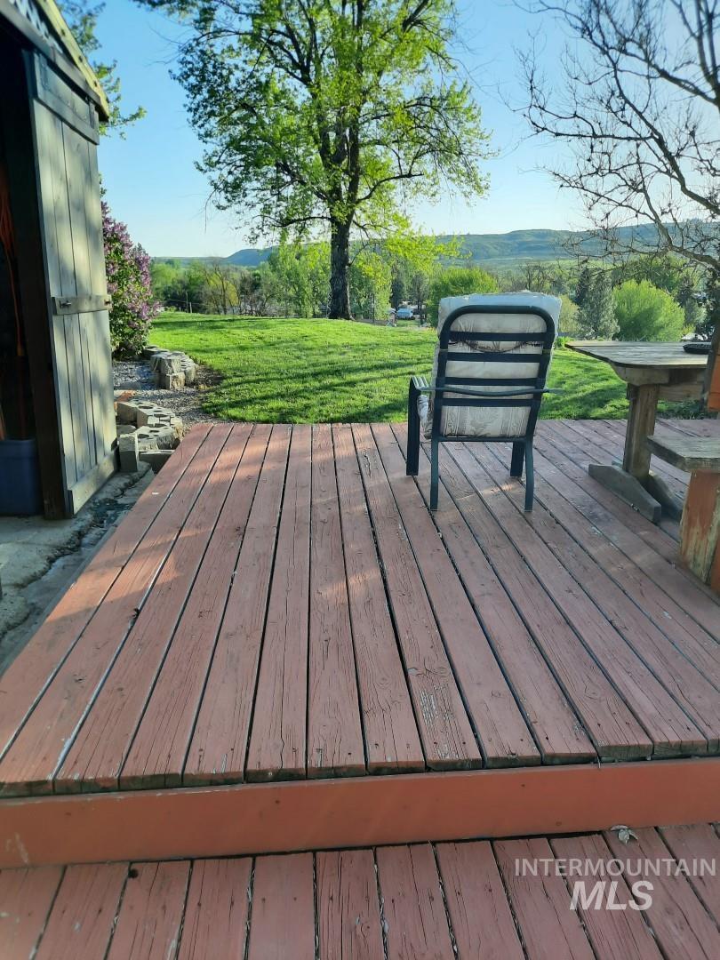 Wooden terrace with a lawn