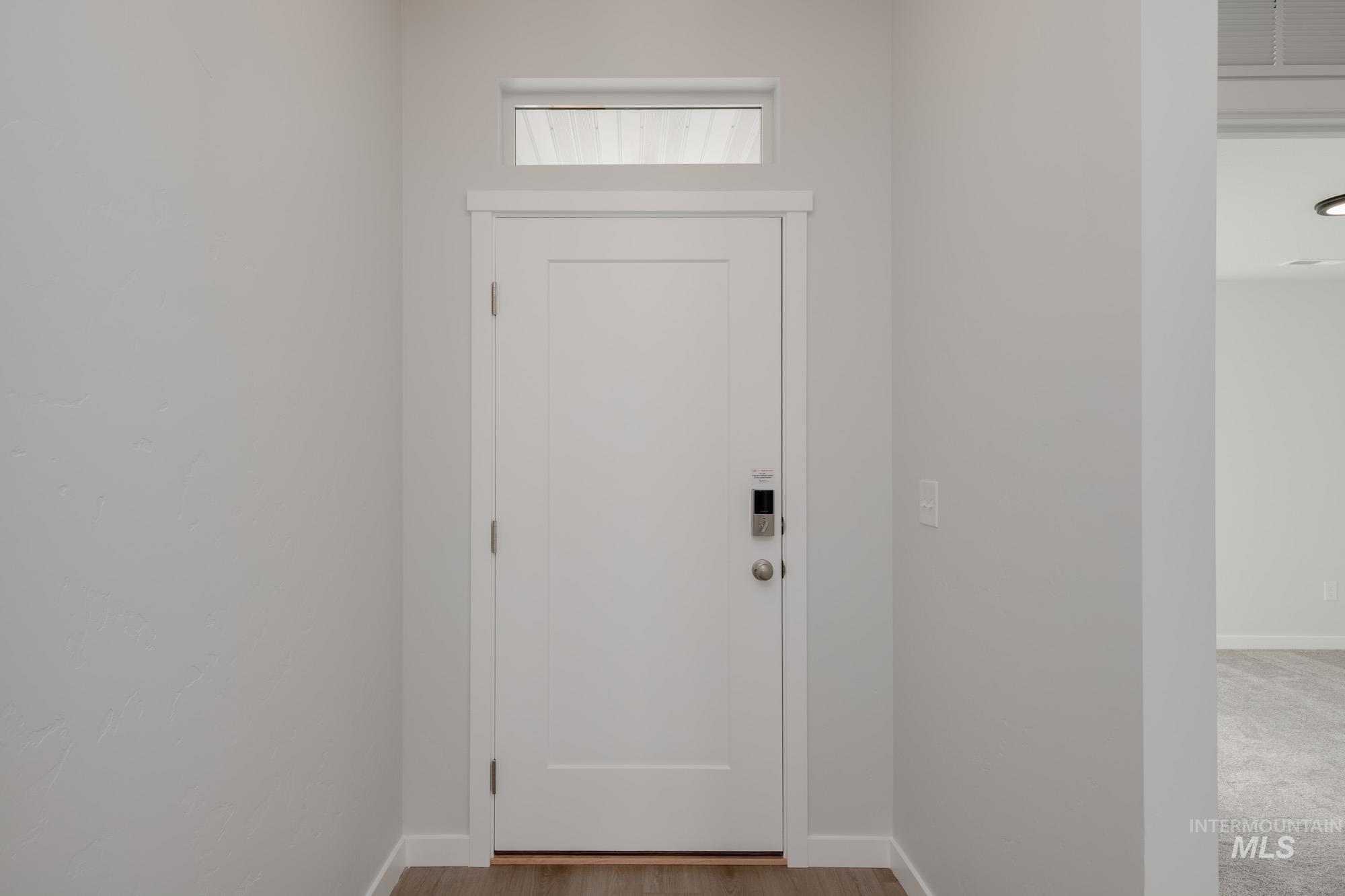 Entryway with wood finished floors