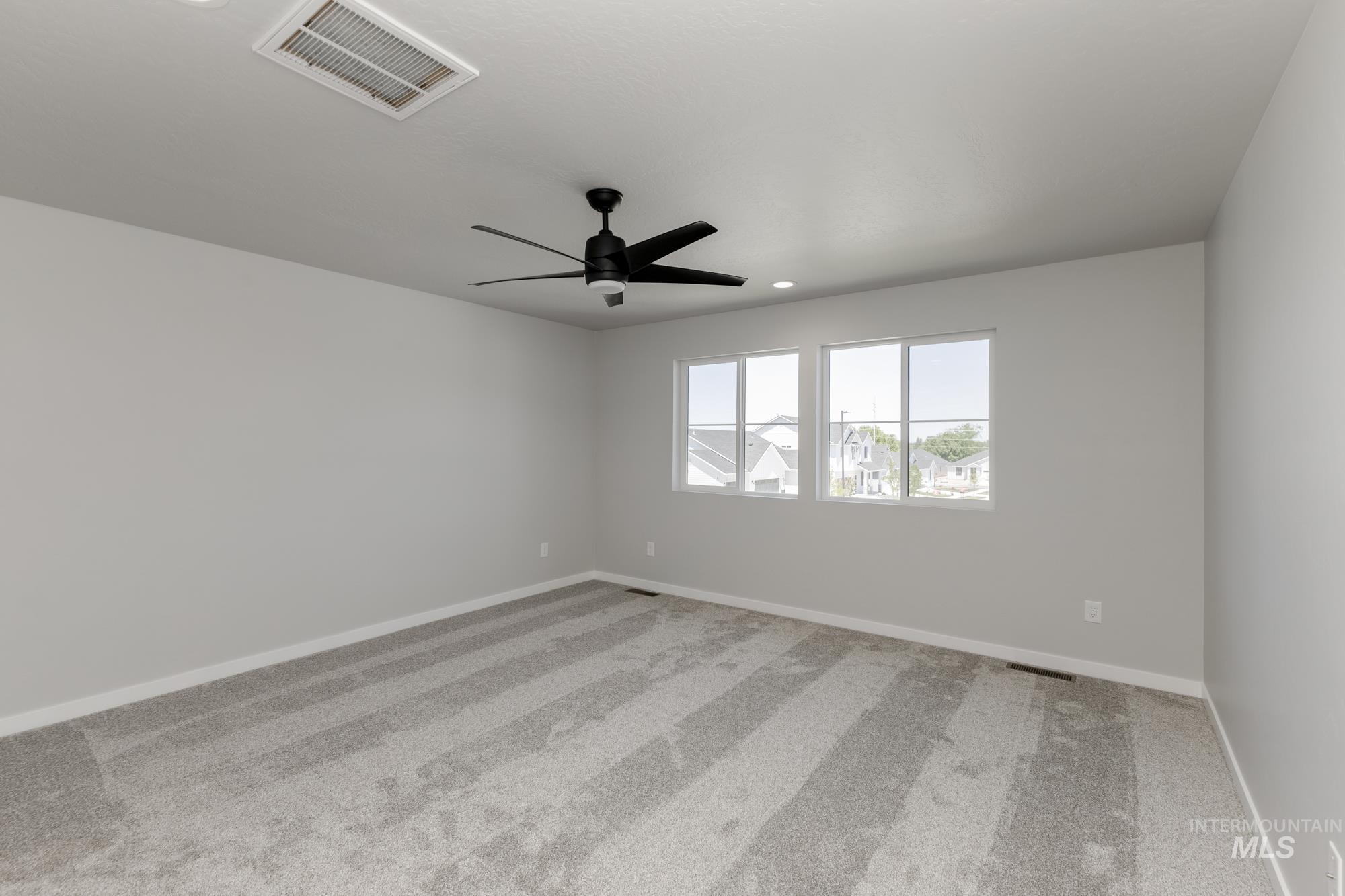 Unfurnished room with carpet floors, recessed lighting, and a ceiling fan