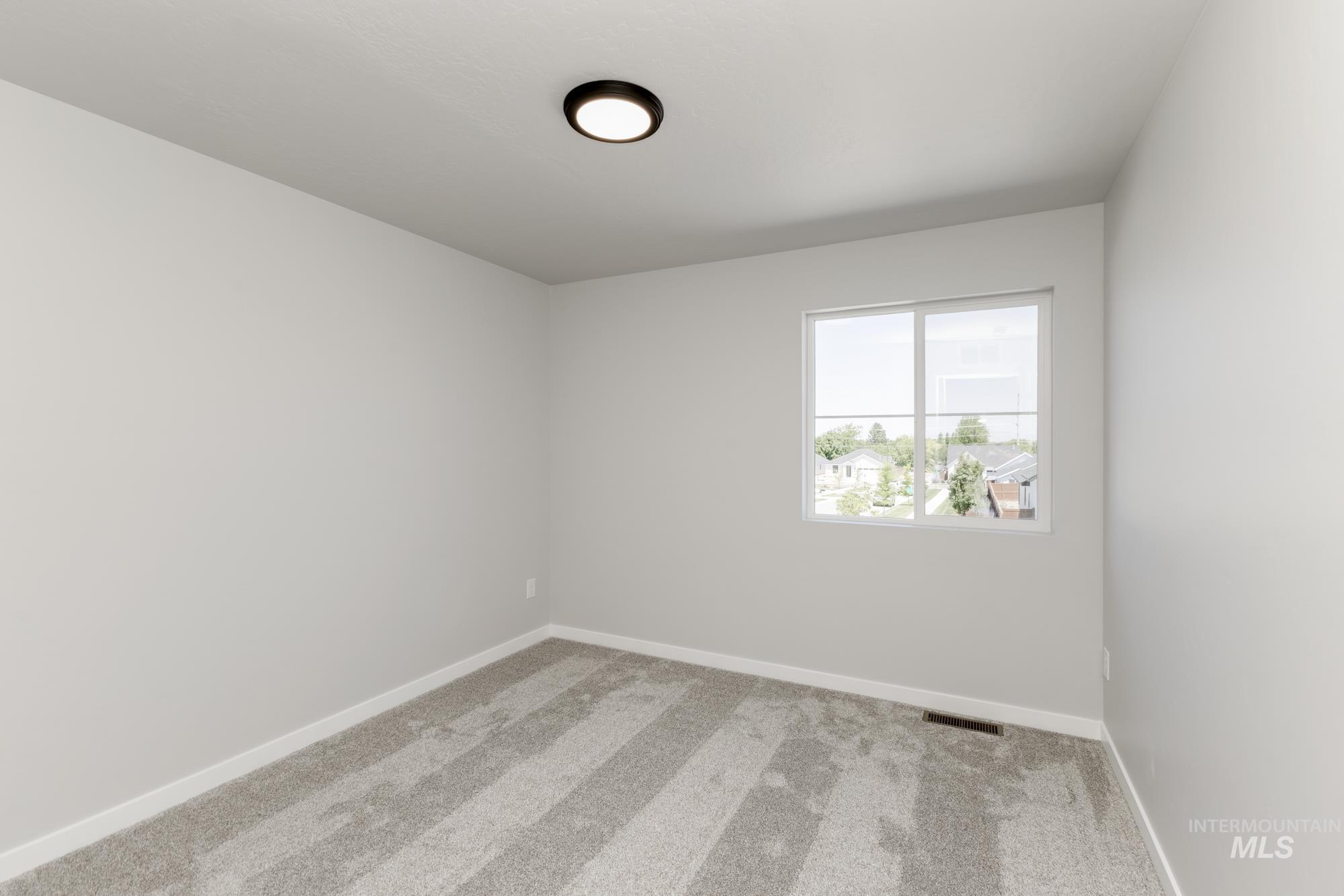 Unfurnished room featuring carpet floors