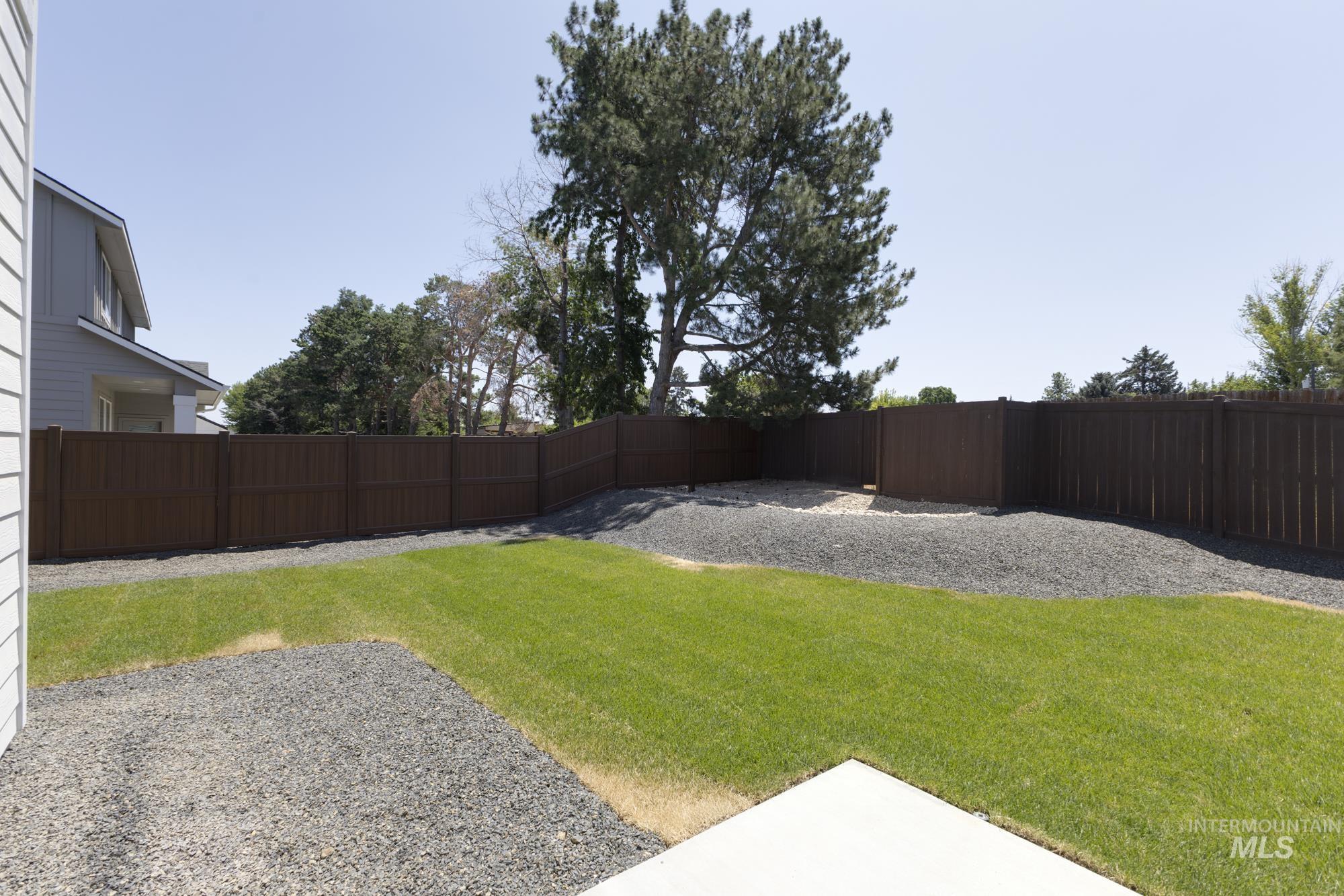 View of fenced backyard